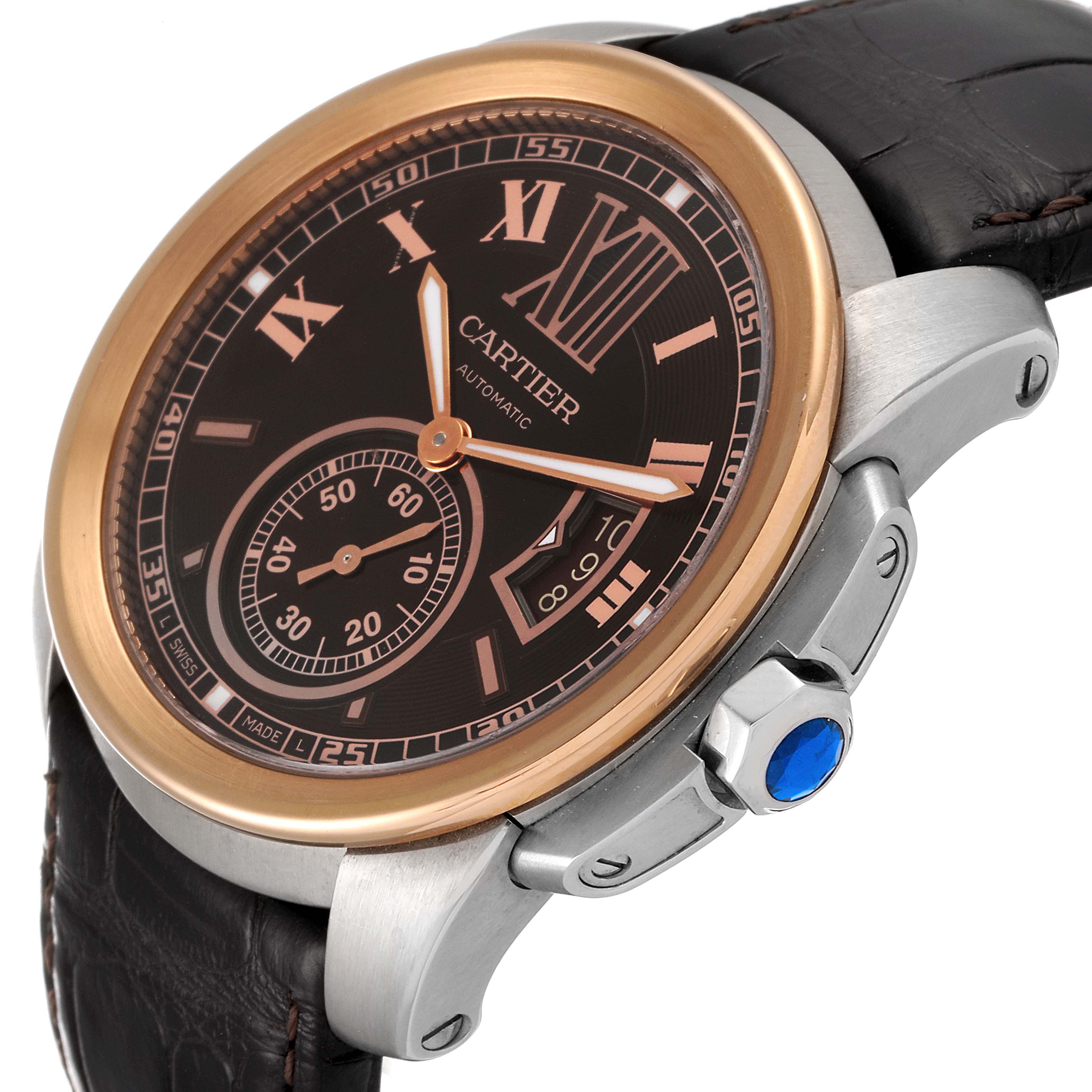 The image shows a close-up, oblique angle of the Calibre de Cartier watch by Cartier, highlighting its dial, crown, and strap.