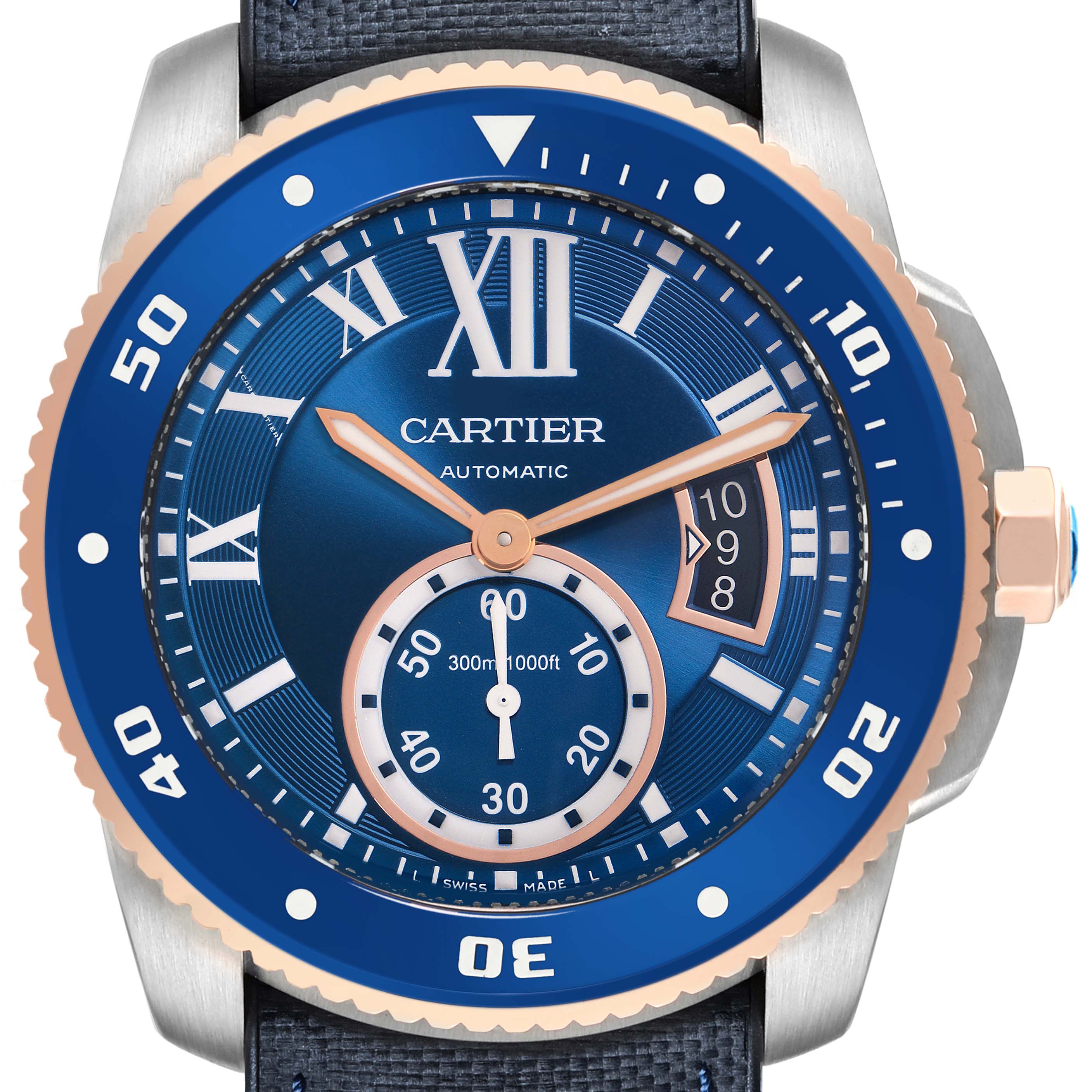 The image shows a frontal view of the Calibre de Cartier watch, displaying its blue dial, gold hands, and rotating bezel.