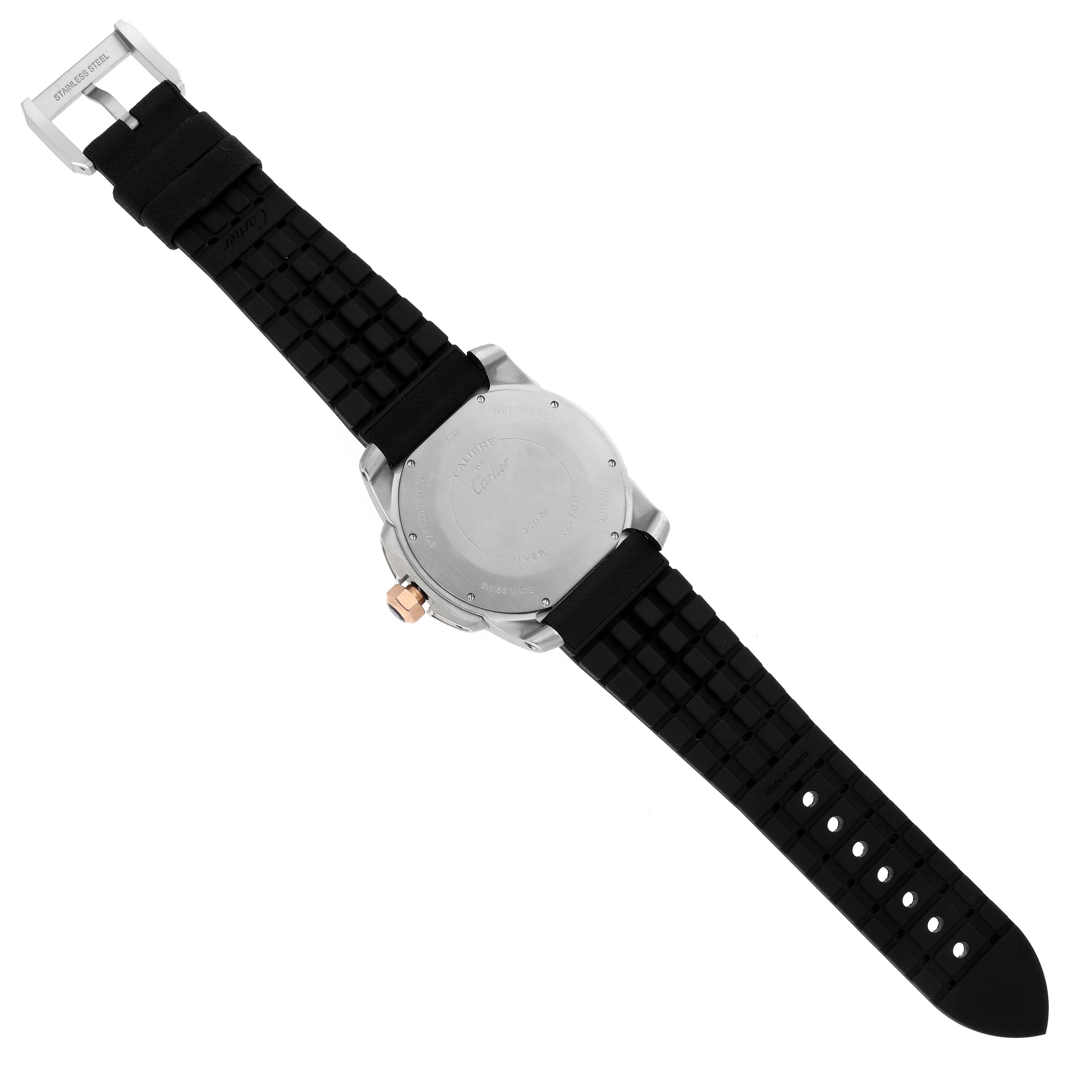 The image shows the back of a Calibre de Cartier watch, displaying the case back, crown, buckle, and strap.