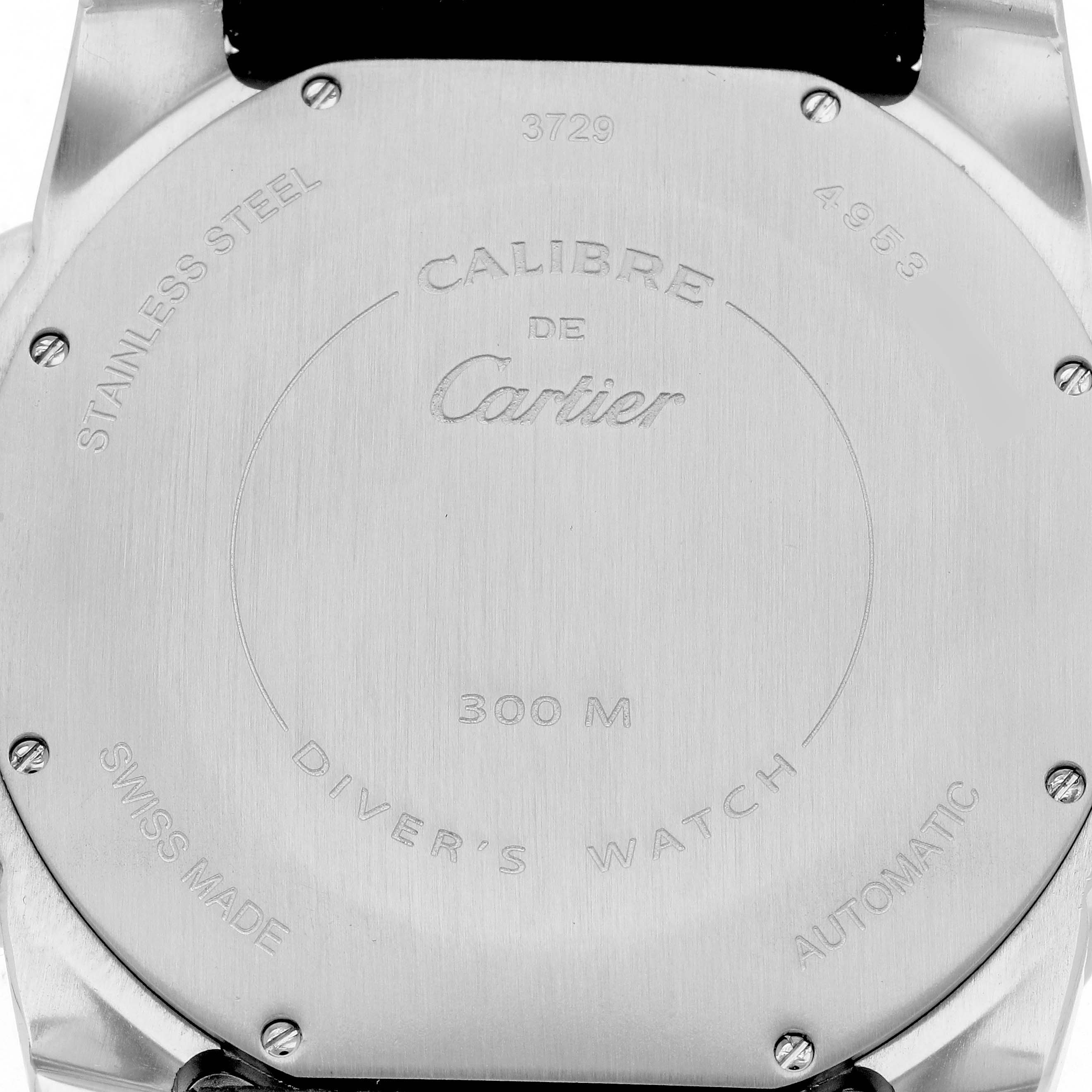 The image shows the back case of a Calibre de Cartier watch, highlighting its engraving and specifications.