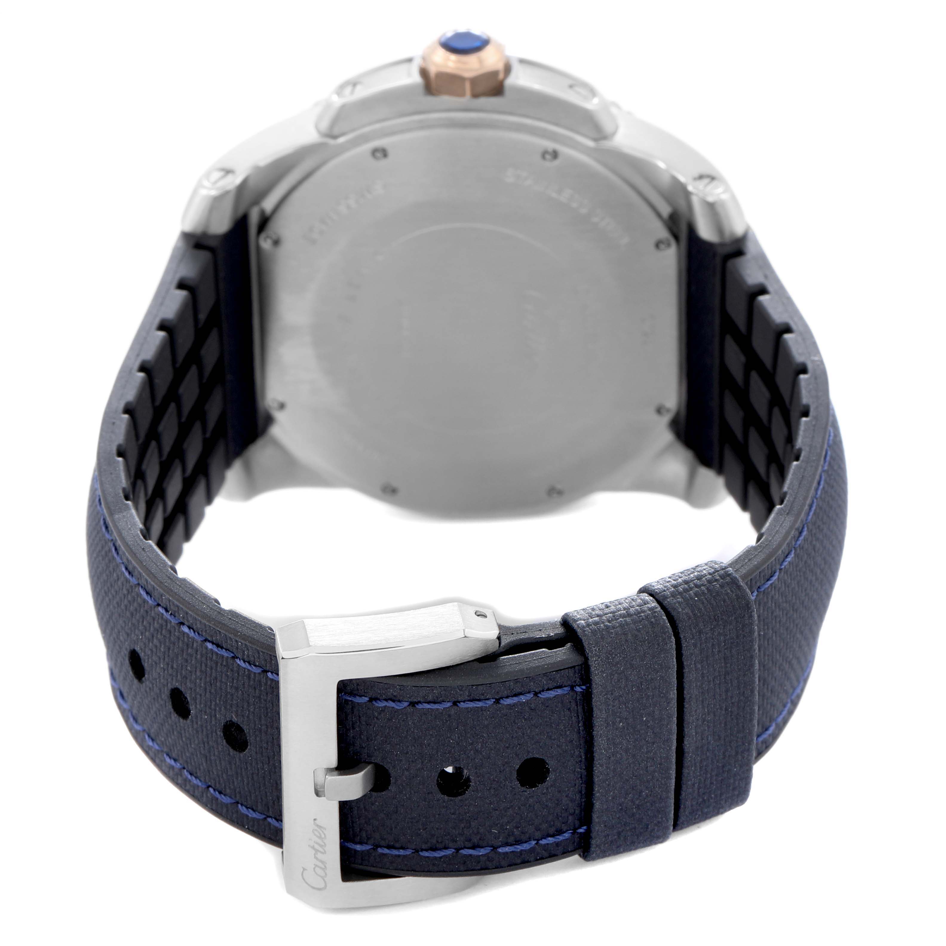 The image shows the back view of a Calibre de Cartier watch by Cartier, highlighting the case back, strap, and buckle.