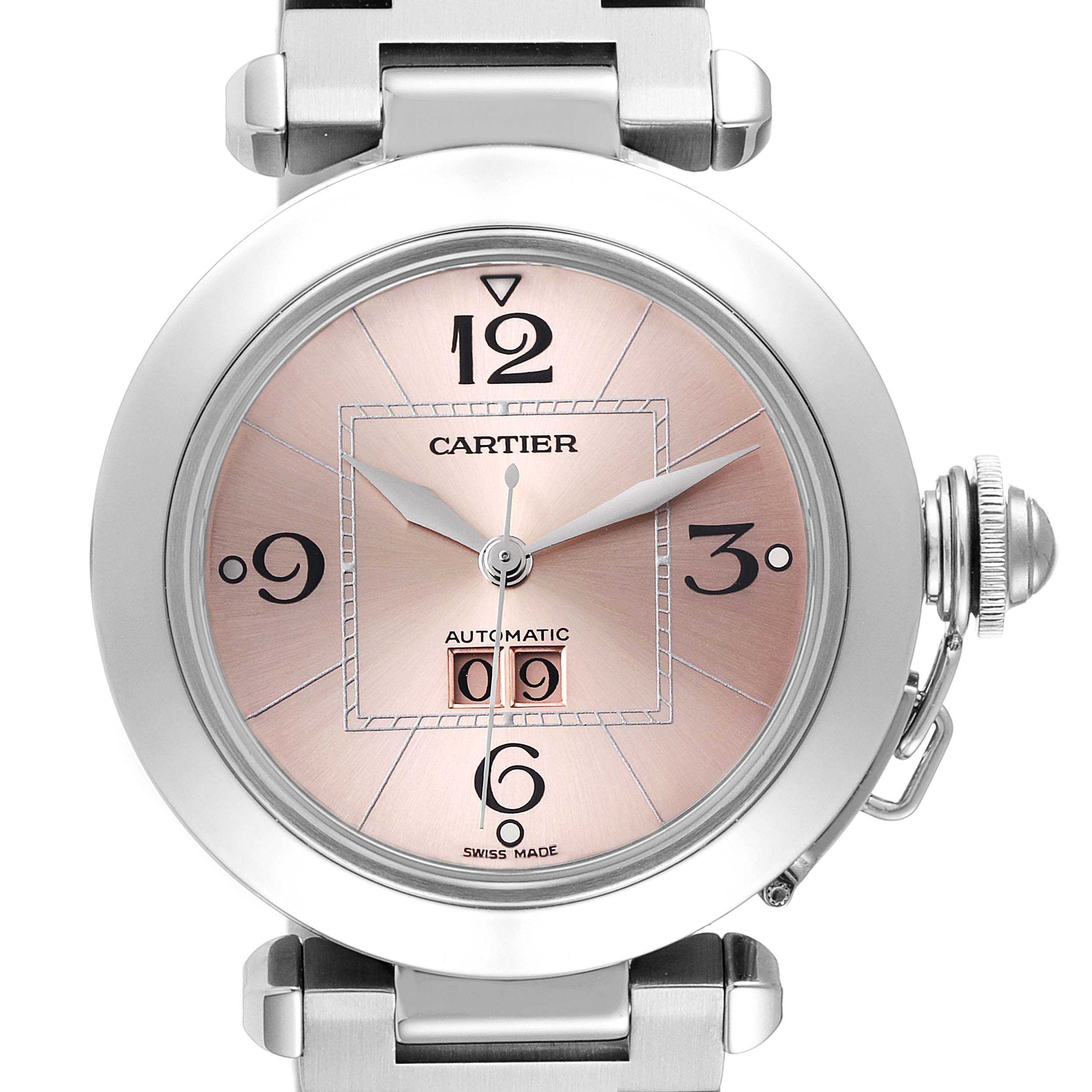 The Cartier Pasha W31058M7 Men's Stainless Steel Pink Dial W31058M7 Men's Stainless Steel Pink Dial watch is shown from a top-down angle, displaying the face, hands, crown, and part of the bracelet.