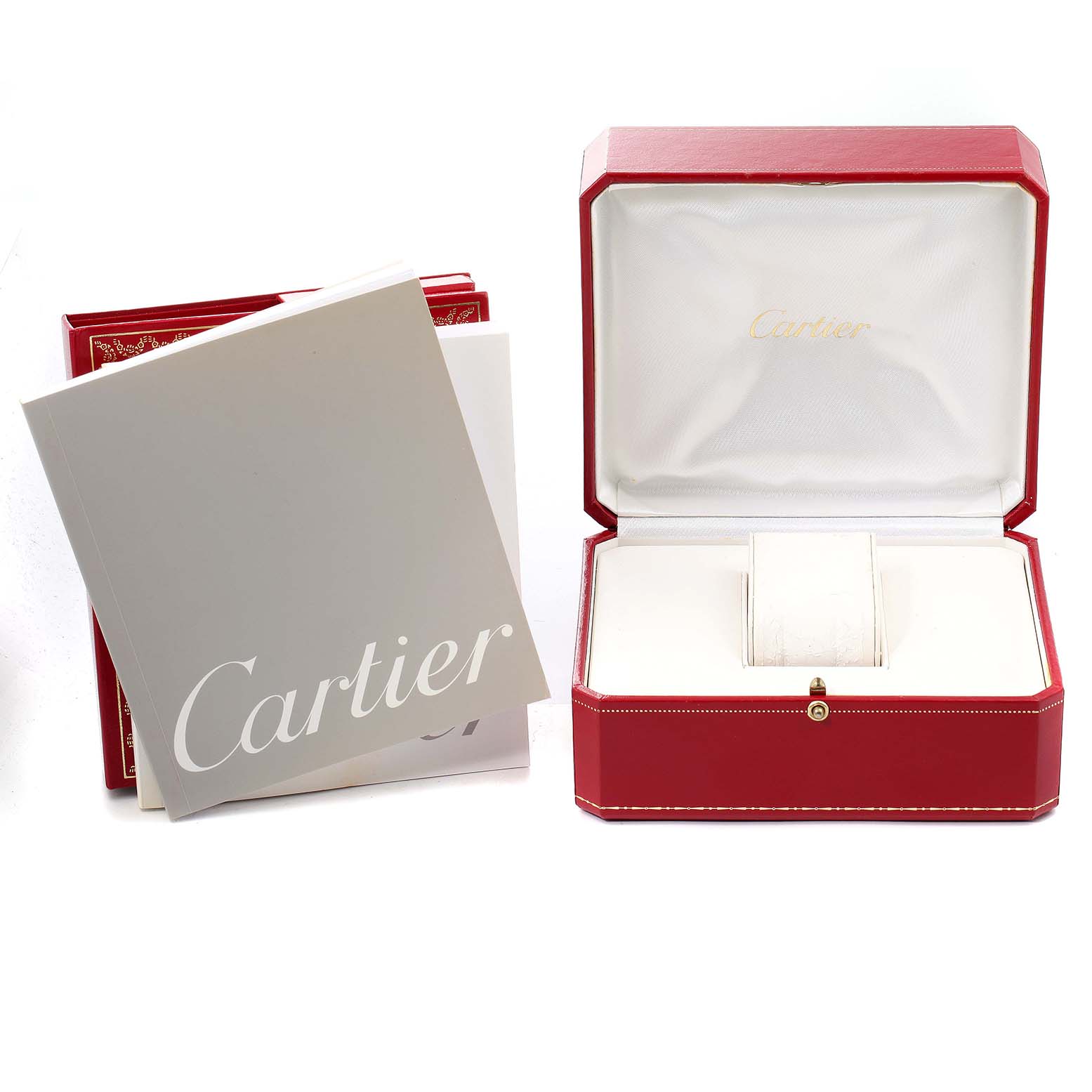 This image shows the packaging and instruction manuals for the Cartier Pasha W31058M7 Men's Stainless Steel Pink Dial W31058M7 Men's Stainless Steel Pink Dial watch, including a red box and booklets.