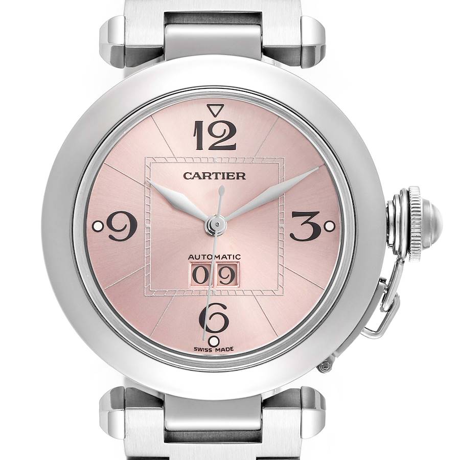 The Cartier Pasha watch is shown from a front angle, highlighting its pink dial, numerals, date window, and crown detail.