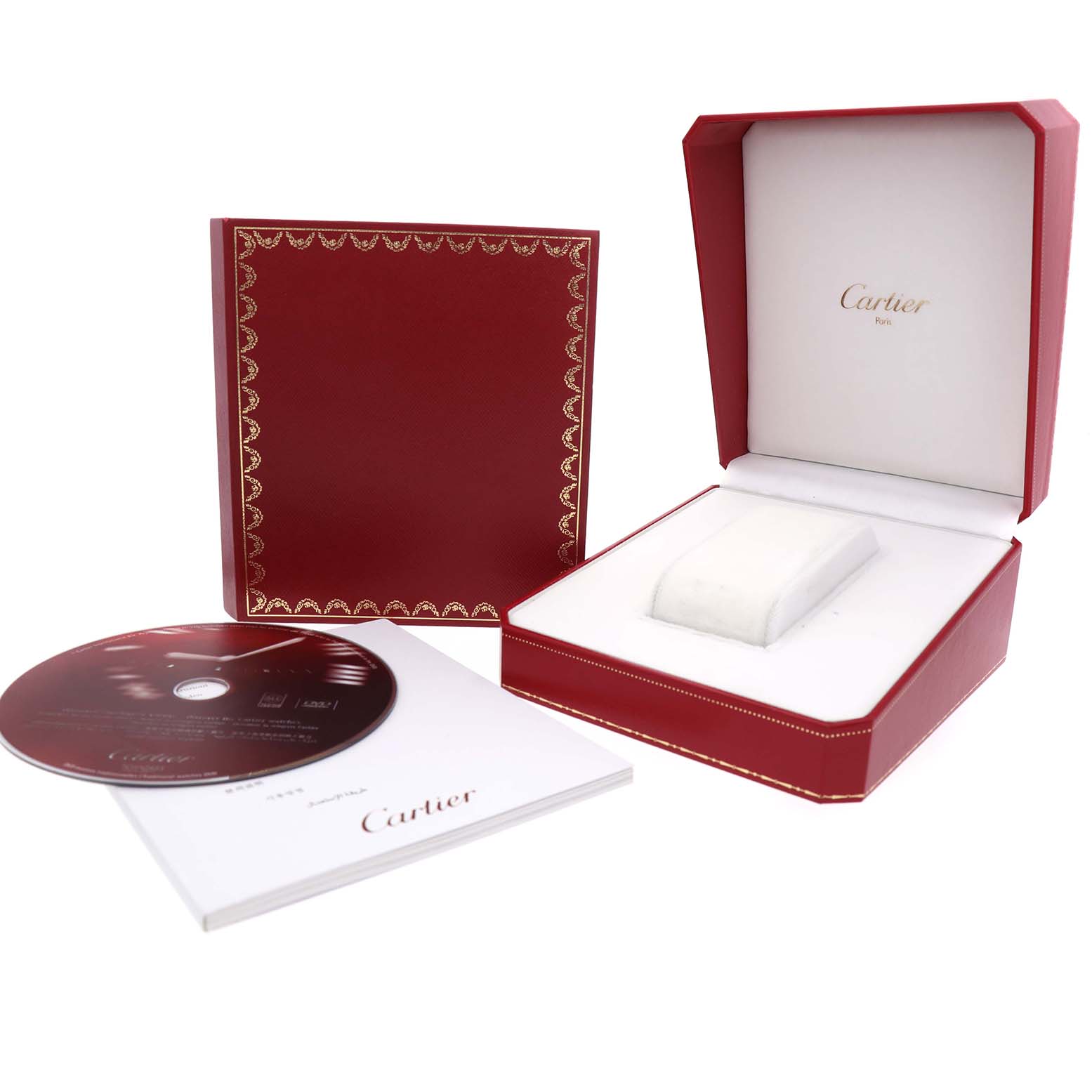 The image shows the Cartier Roadster W62032X6 Men's Stainless Steel Silver Dial watch's packaging, including the open red box, manual, and CD at a slight angle.
