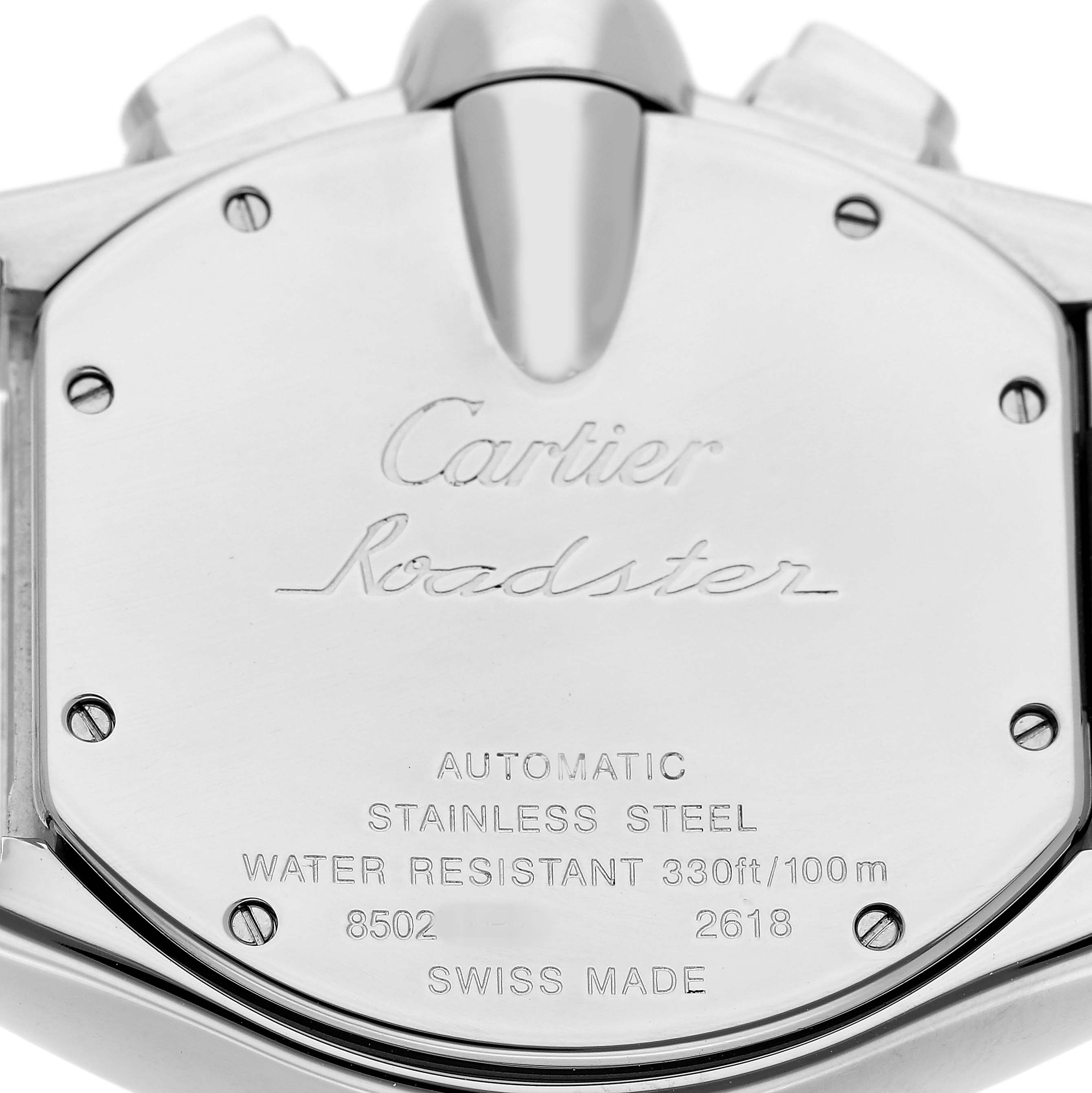 The image shows the back of the Cartier Roadster W62019X6 Men's Stainless Steel Silver Dial watch, highlighting its engravings and stainless steel casing.