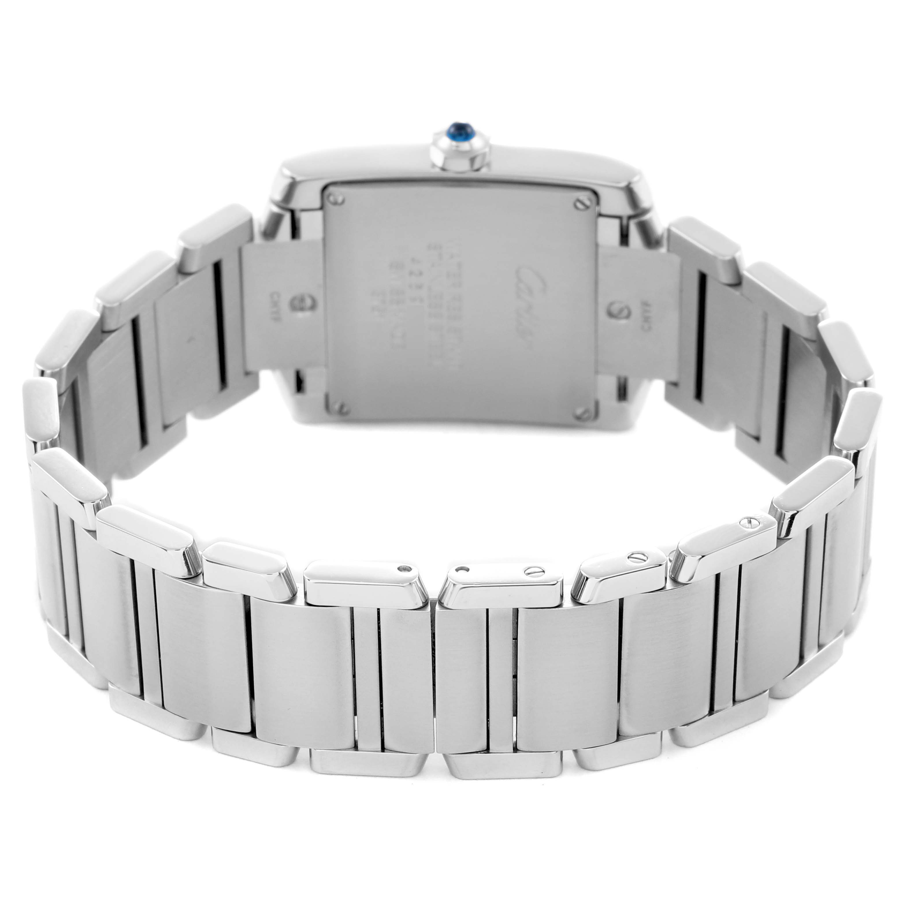 The Cartier Tank Française watch is shown from the back, highlighting the metal bracelet and case with the crown visible.