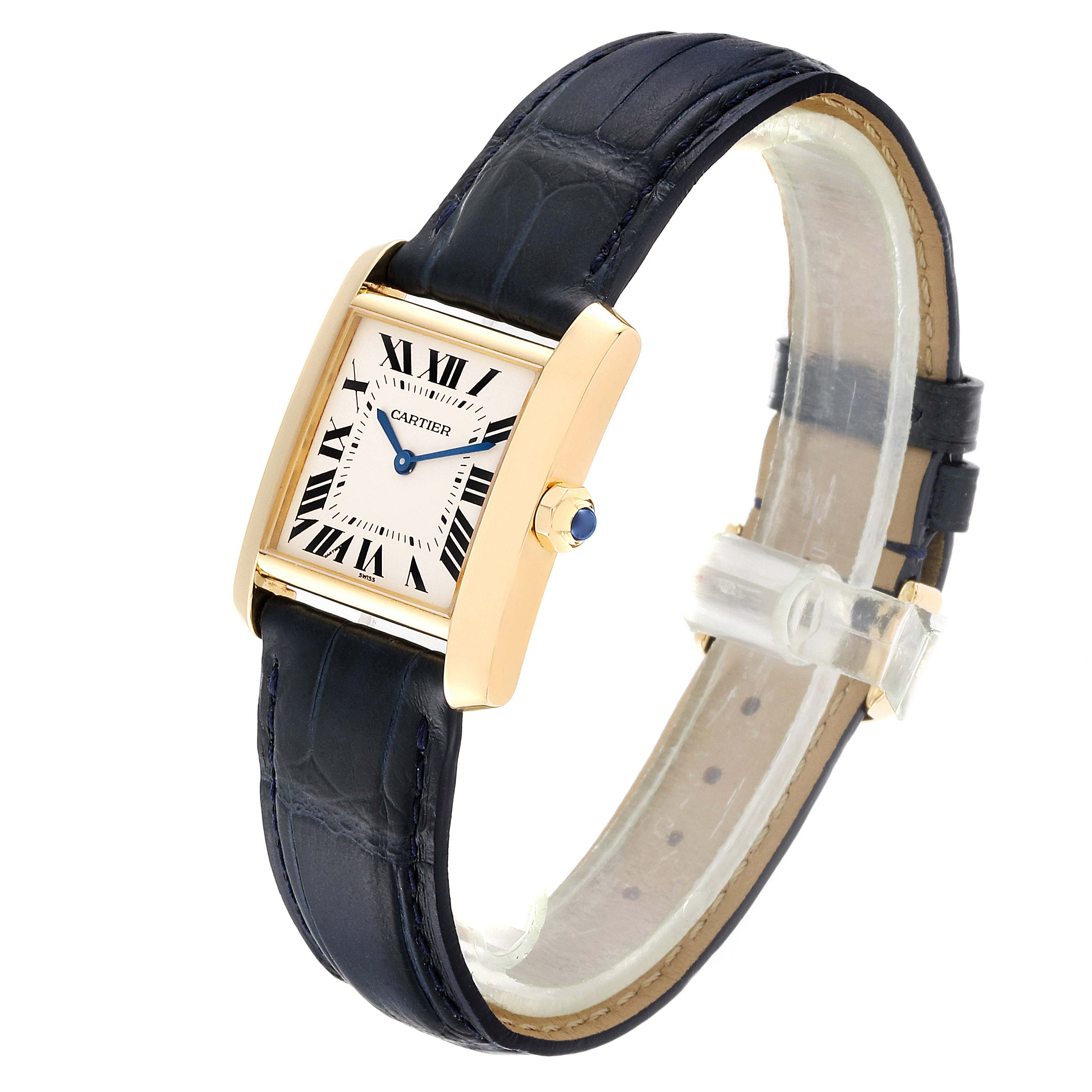 The Cartier Tank Francaise W5000356 Women
s Yellow Gold Silver Dial W5000356 Women
s Yellow Gold Silver Dial watch is shown at an angled view, highlighting the rectangular face, Roman numerals, gold case, and black leather strap.