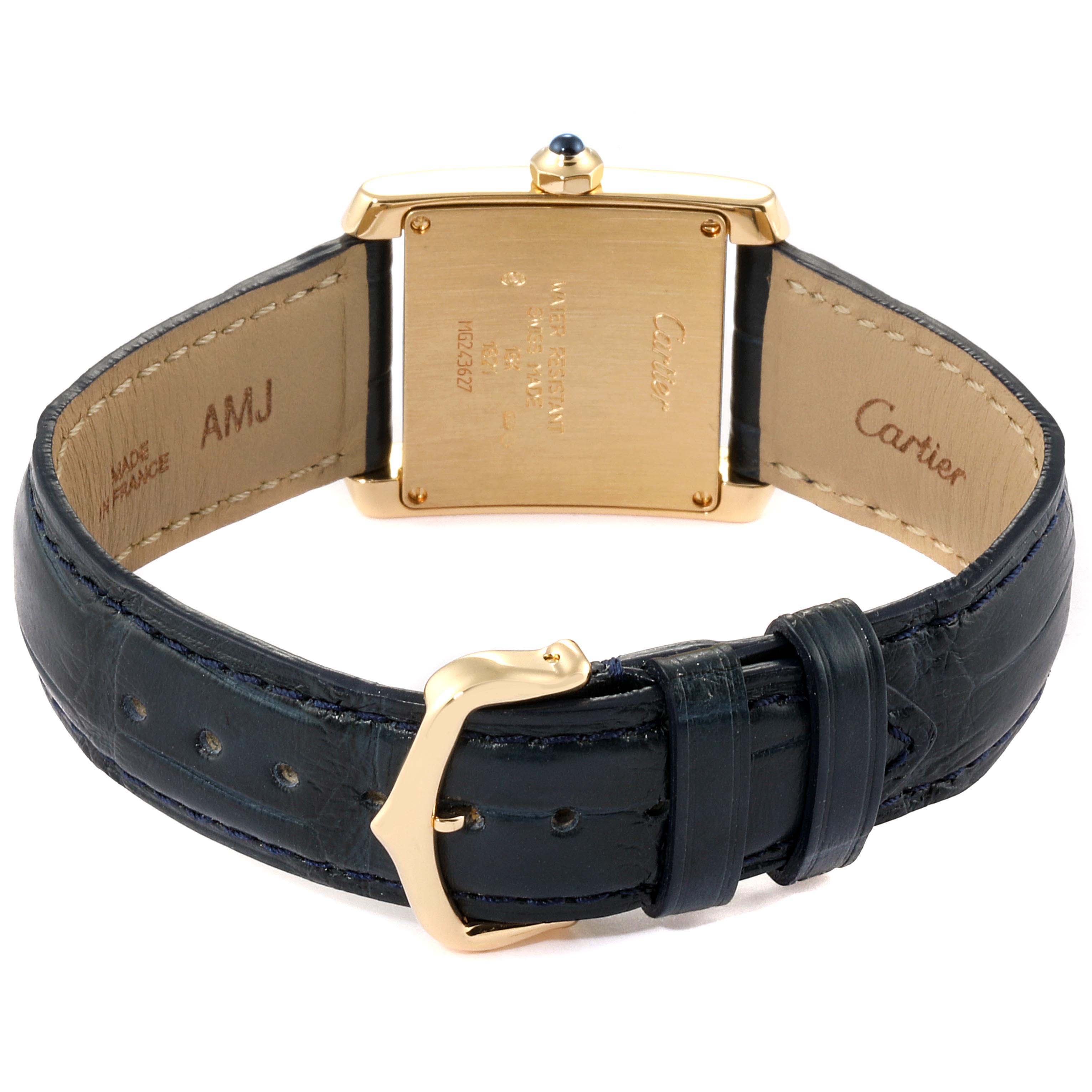 The image shows the back view of a Cartier Tank Francaise W5000356 Women
s Yellow Gold Silver Dial W5000356 Women
s Yellow Gold Silver Dial watch, highlighting its case back, strap, and buckle.