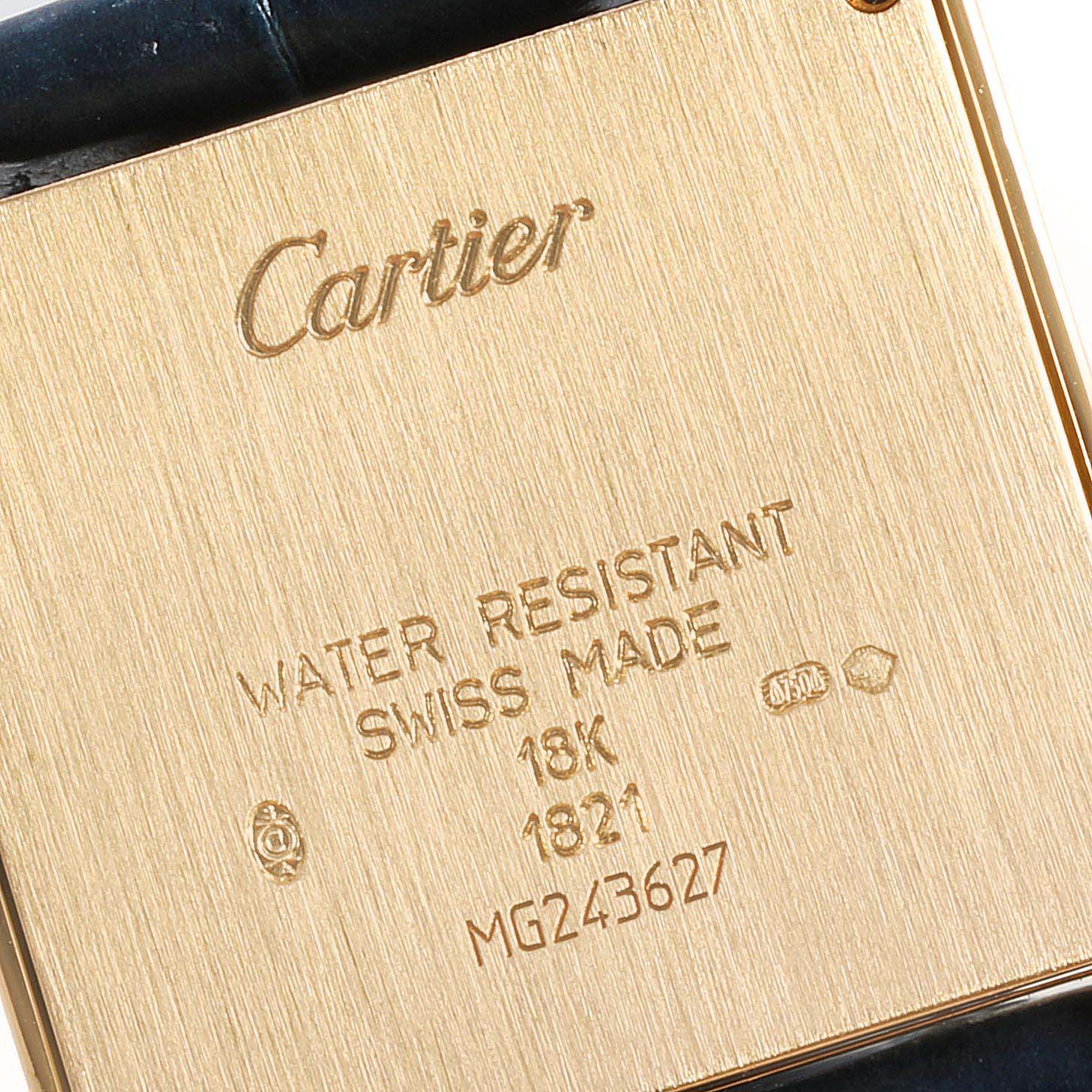 The image shows the back case of a Cartier Tank Francaise W5000356 Women
s Yellow Gold Silver Dial W5000356 Women
s Yellow Gold Silver Dial watch, displaying engravings and hallmark details.