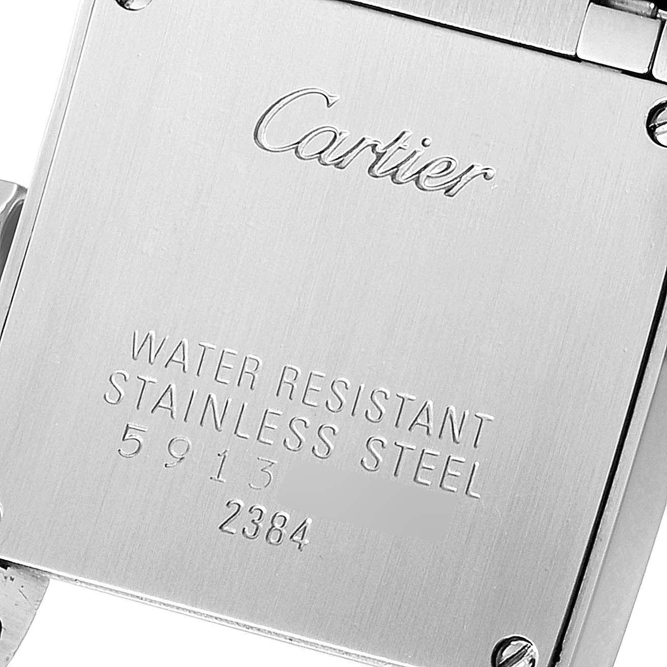 This image shows the back case of a Cartier Tank Francaise W51028Q3 Women
s Stainless Steel Mother of Pearl Dial W51028Q3 Women
s Stainless Steel Mother of Pearl Dial watch with its inscriptions.