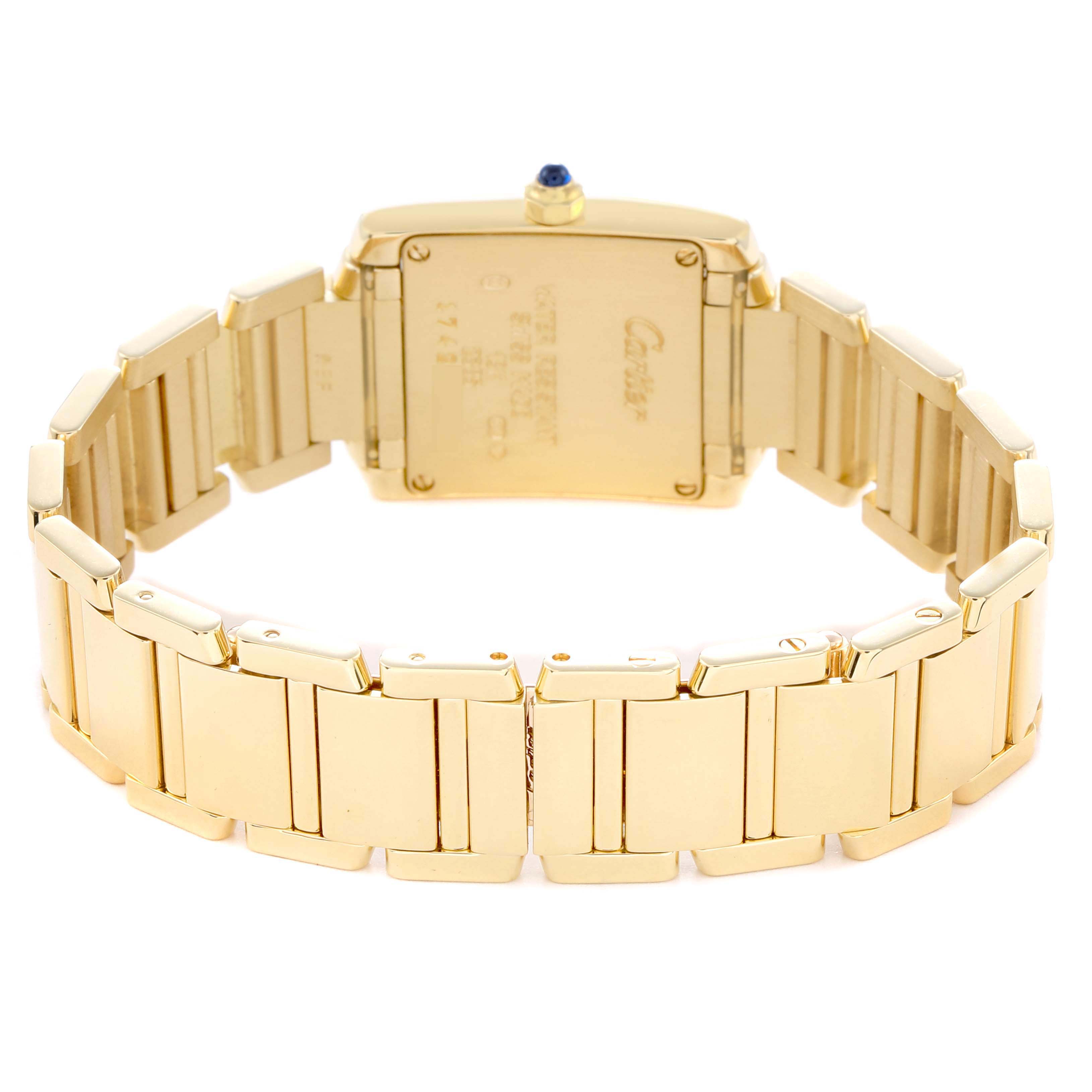 The image shows the back and bracelet of a Cartier Tank Française watch, featuring a gold finish and blue cabochon on the crown.