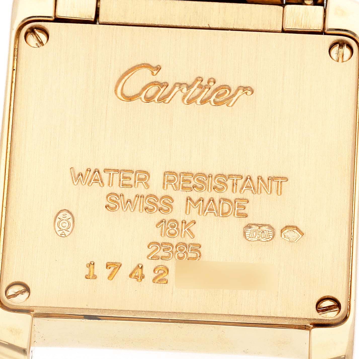 The image shows the back case of a Cartier Tank Francaise W50002N2 Women
s Yellow Gold Silver Dial W50002N2 Women
s Yellow Gold Silver Dial, highlighting the brand, model, and specifications like water resistance and material.