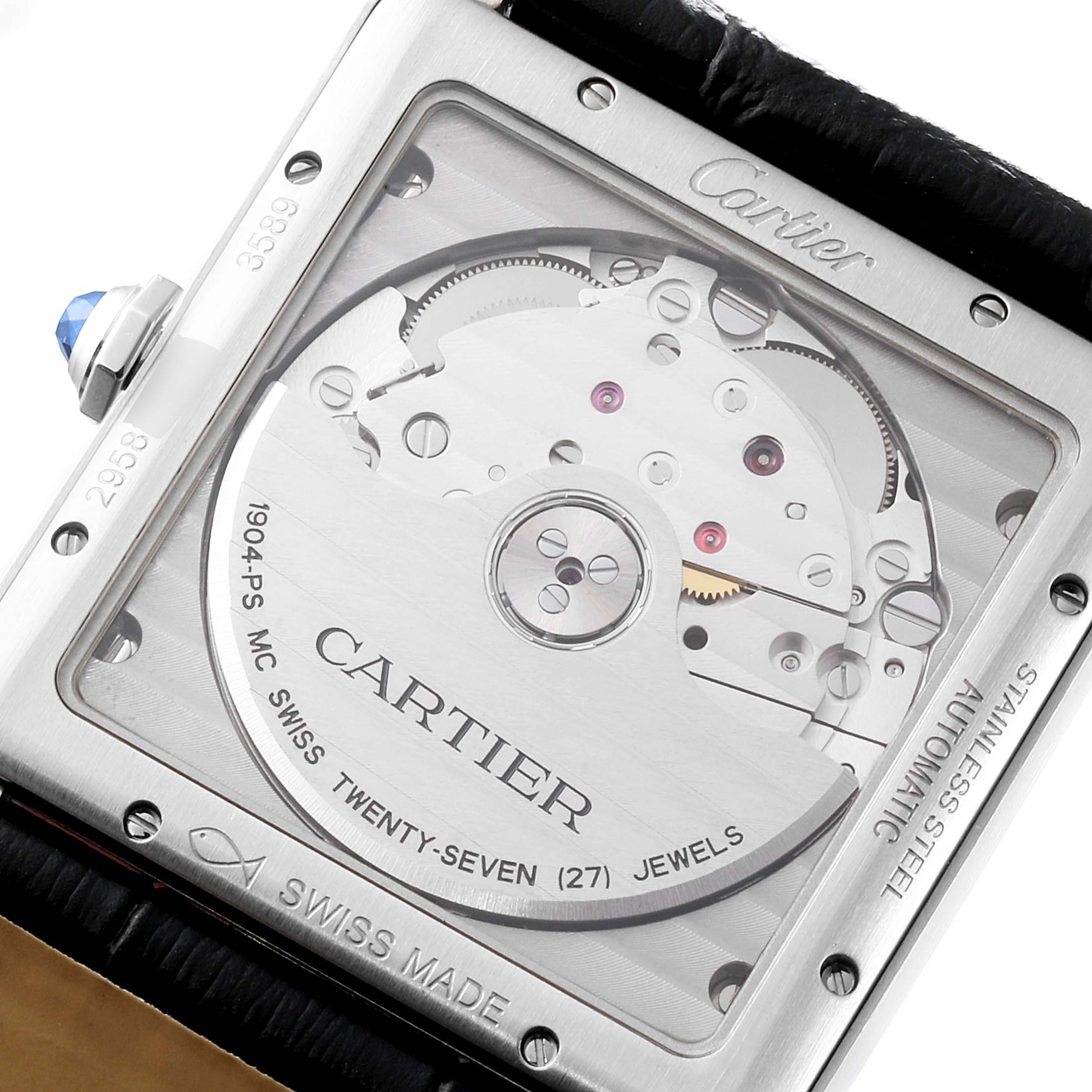 The image shows the back of a Tank MC model by Cartier, highlighting its movement visible through a transparent case back.