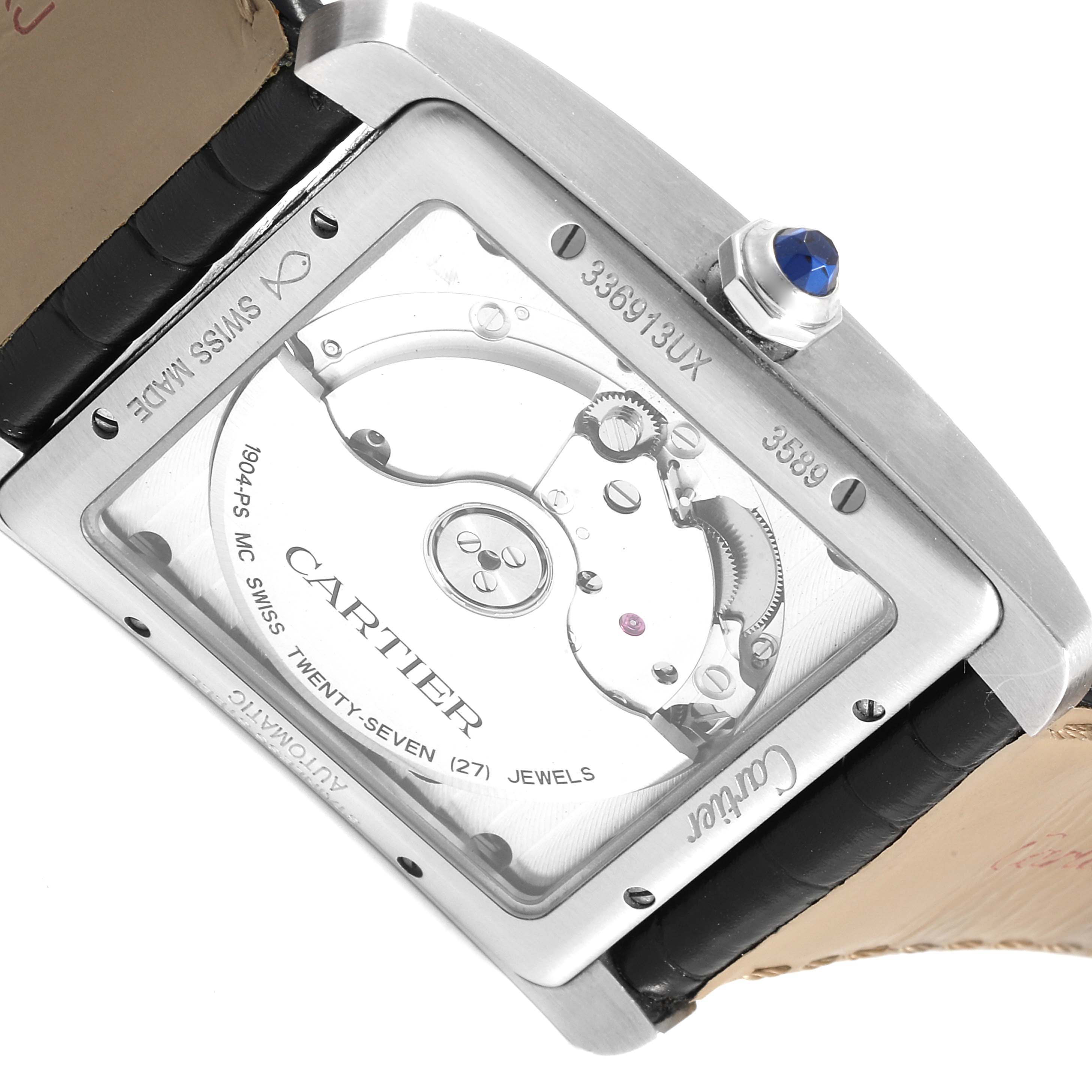 The image shows the back view of the Cartier Tank MC W5330003 Men's Stainless Steel Silver Dial W5330003 Men's Stainless Steel Silver Dial watch, highlighting its movement and the crown with a blue cabochon.