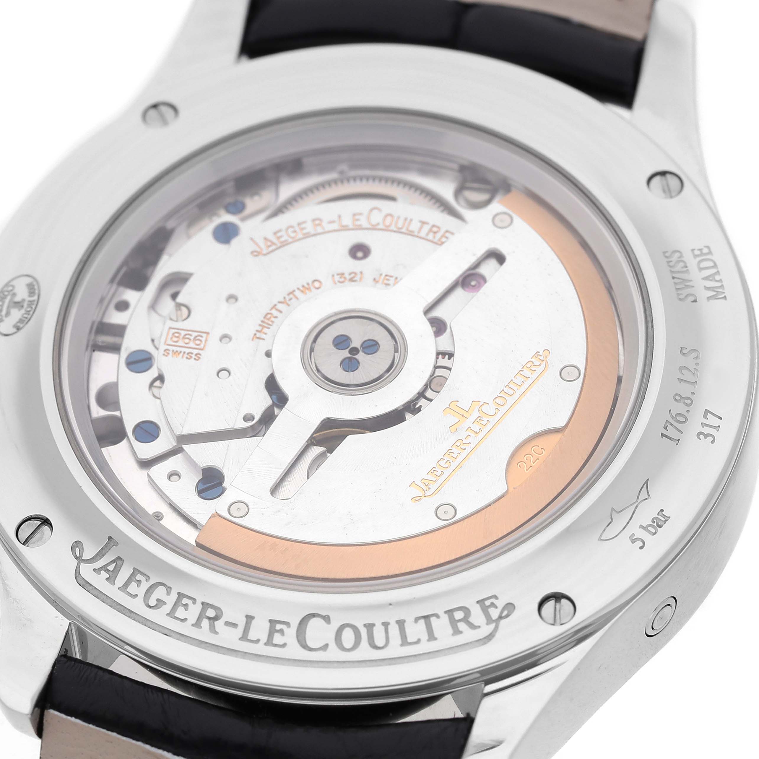 The Jaeger-LeCoultre Master watch is shown from the back, highlighting its transparent case back and intricate movement details.