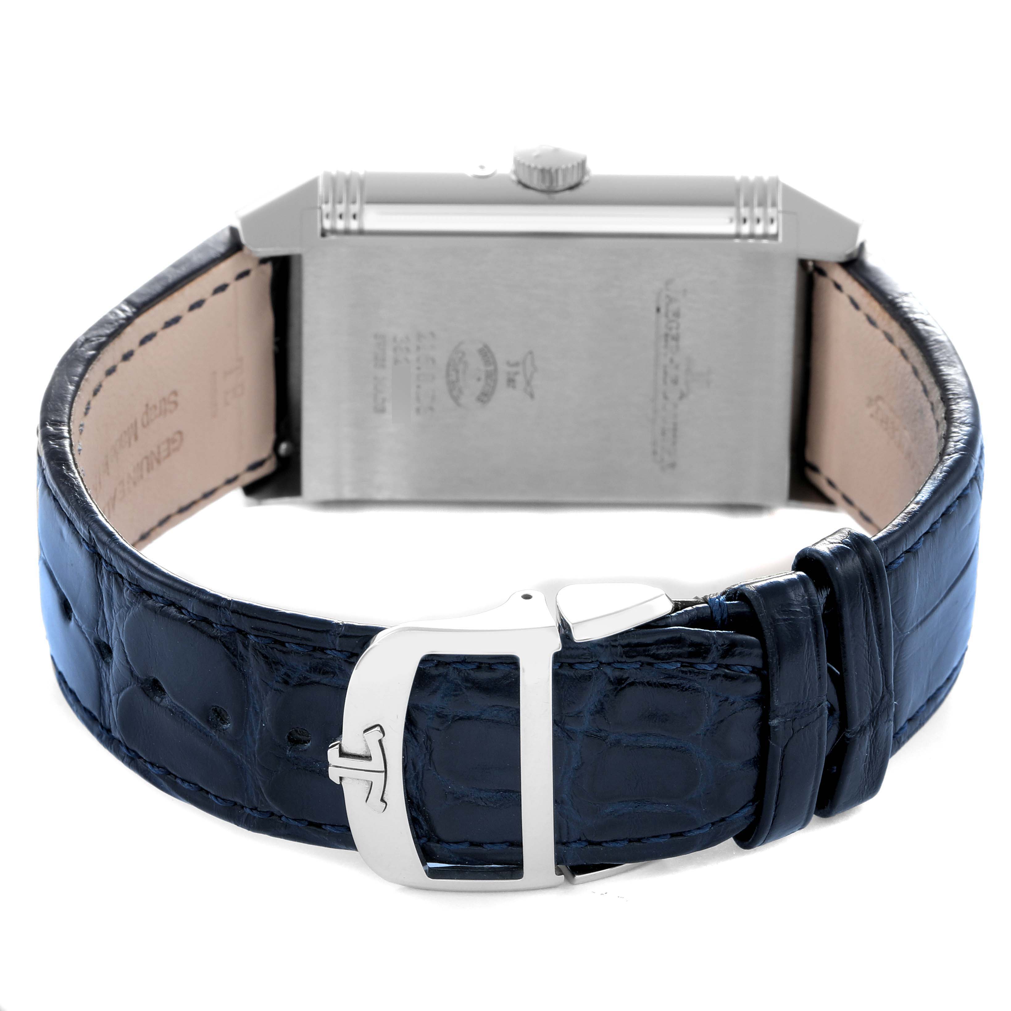 The Jaeger-LeCoultre Reverso watch is shown from the back, displaying the case back and strap with buckle detail.
