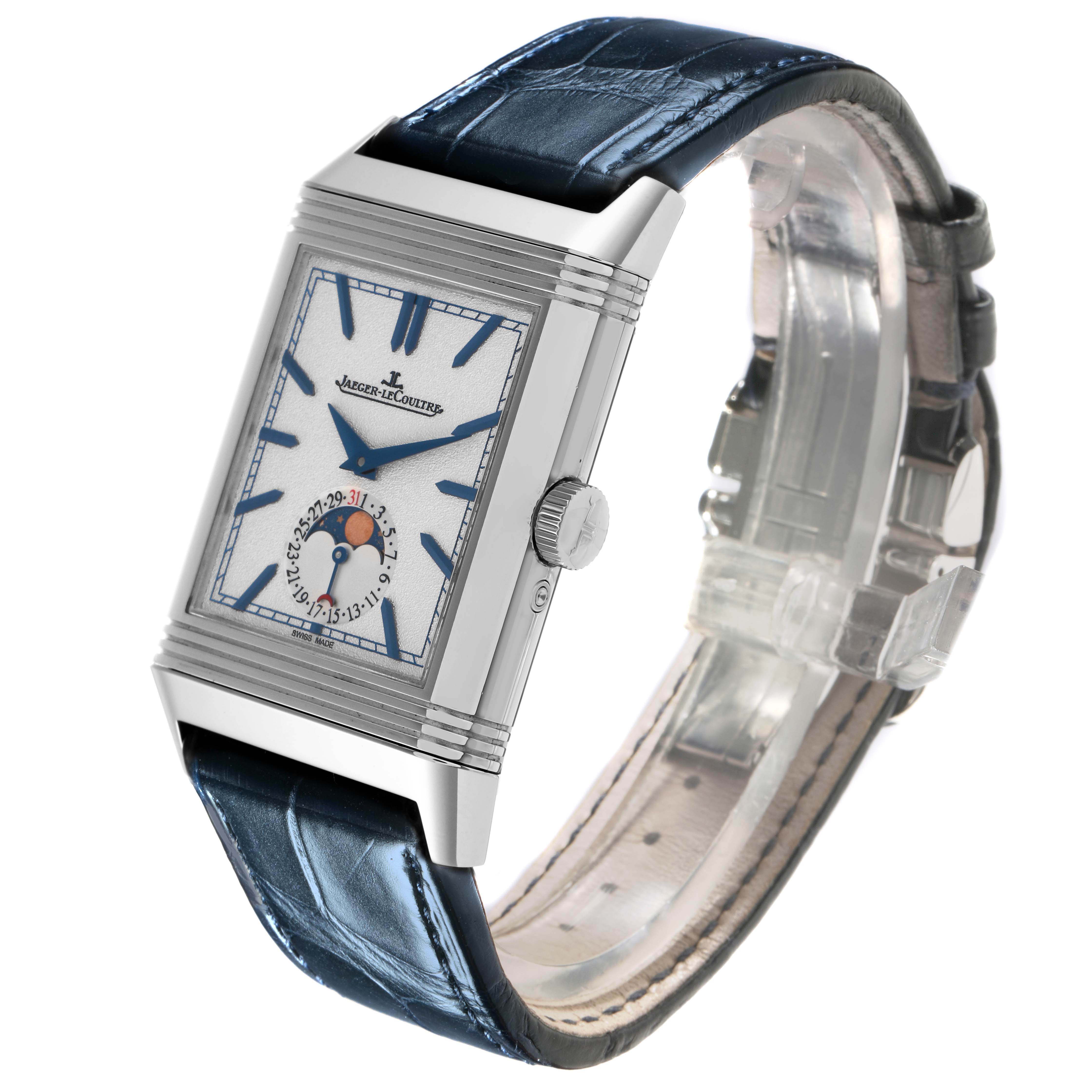The Jaeger-LeCoultre Reverso watch is shown at an angle highlighting the rectangular dial, crown, and leather strap.