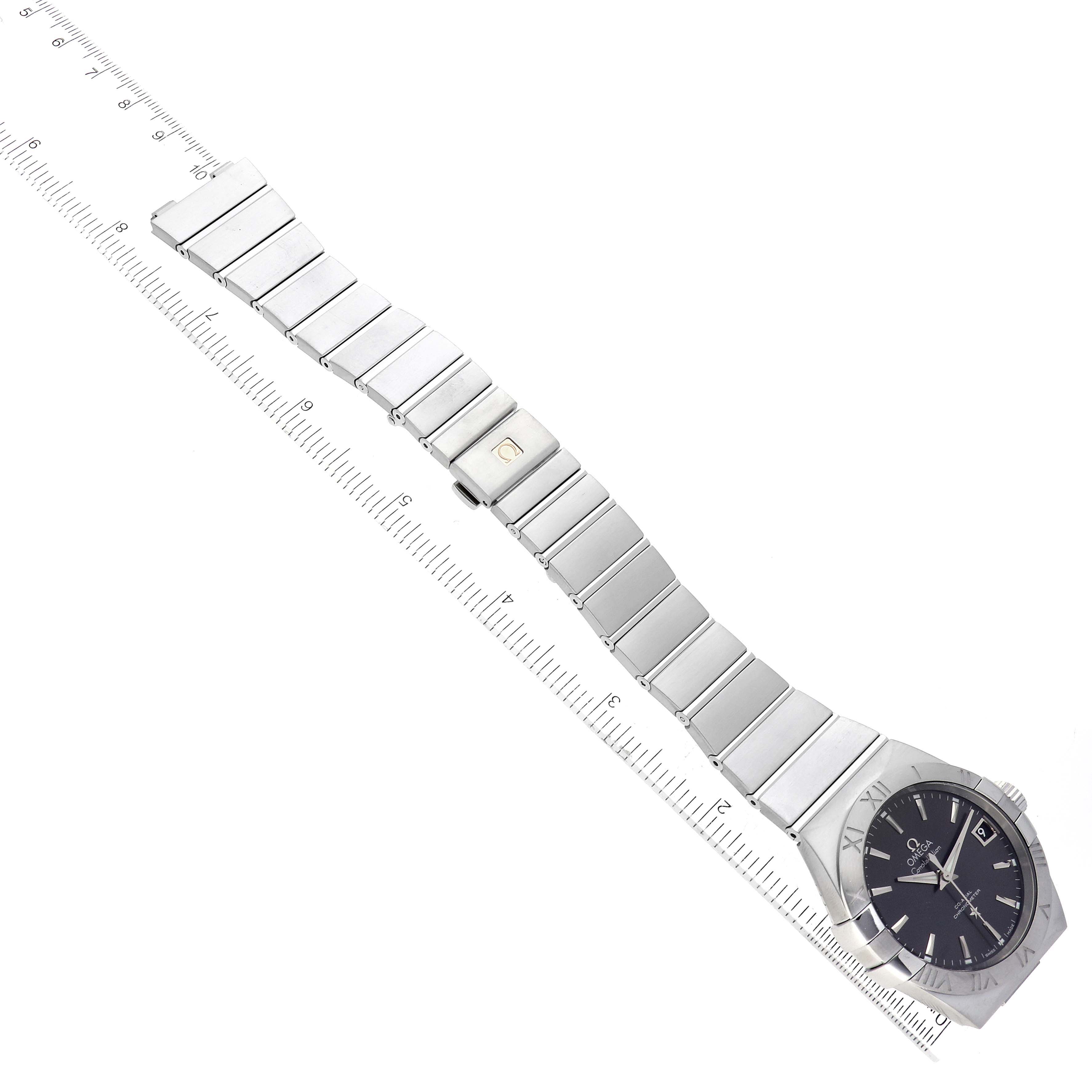 The image shows an Omega Constellation 123.10.38.21.06.001 Men's Stainless Steel Grey Dial 123.10.38.21.06.001 Men's Stainless Steel Grey Dial watch laid flat, highlighting its metal bracelet and the face with Roman numerals.