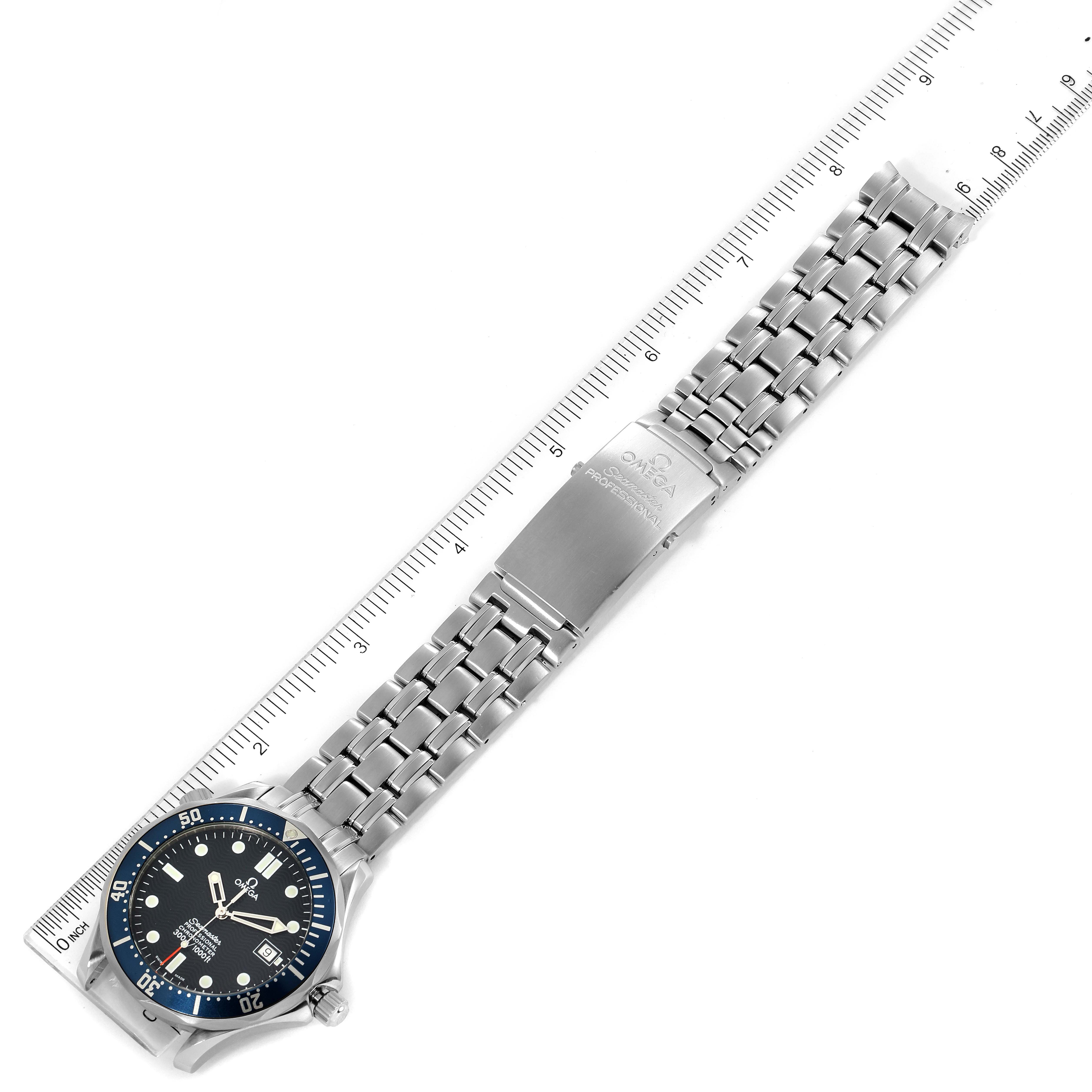 The image shows an Omega Seamaster 2531.80.00 Men
s Stainless Steel Blue Dial 2531.80.00 Men
s Stainless Steel Blue Dial watch laid flat, using a ruler to showcase the length of its metal bracelet.