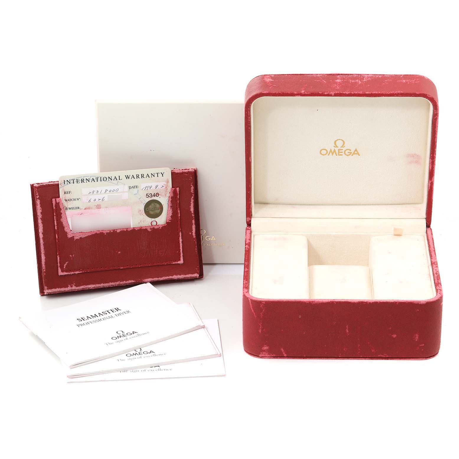 The image shows an Omega Seamaster 2531.80.00 Men
s Stainless Steel Blue Dial 2531.80.00 Men
s Stainless Steel Blue Dial watch
s empty red case, warranty cards, and instruction manual.