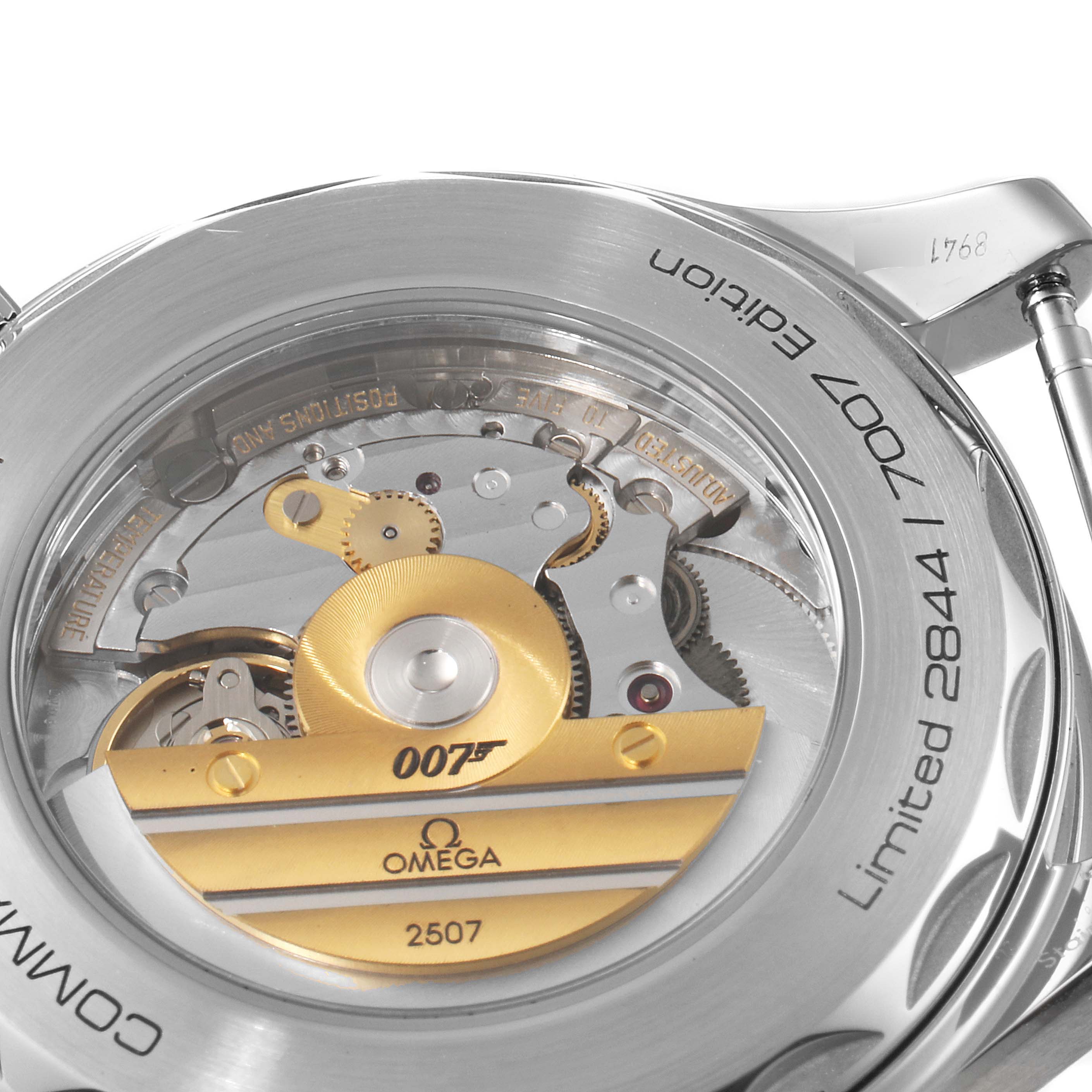 The image shows the detailed back view of the Omega Seamaster 212.32.41.20.04.001 Men's Stainless Steel White Dial 212.32.41.20.04.001 Men's Stainless Steel White Dial model, highlighting its intricate movement mechanics and "007" branding.