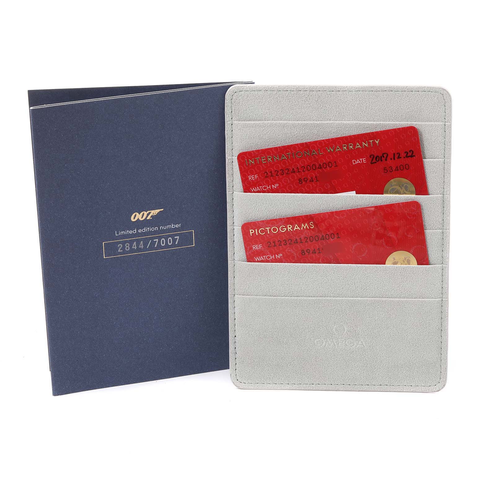 The image shows a limited edition certificate and warranty cards for an Omega Seamaster 212.32.41.20.04.001 Men's Stainless Steel White Dial 212.32.41.20.04.001 Men's Stainless Steel White Dial watch, including international warranty and pictogram cards.