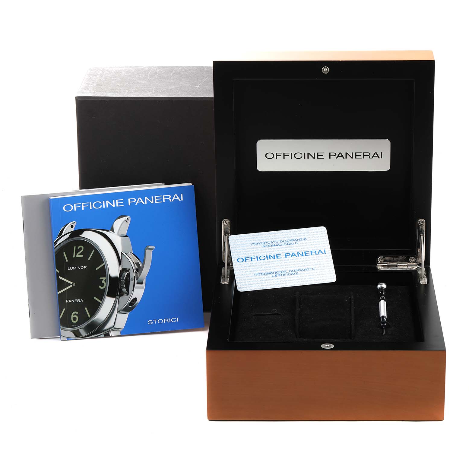 The image shows the packaging and accessories of a Panerai Luminor PAM00524 Men's Stainless Steel Black Dial PAM00524 Men's Stainless Steel Black Dial, including the box, booklet, and warranty card.