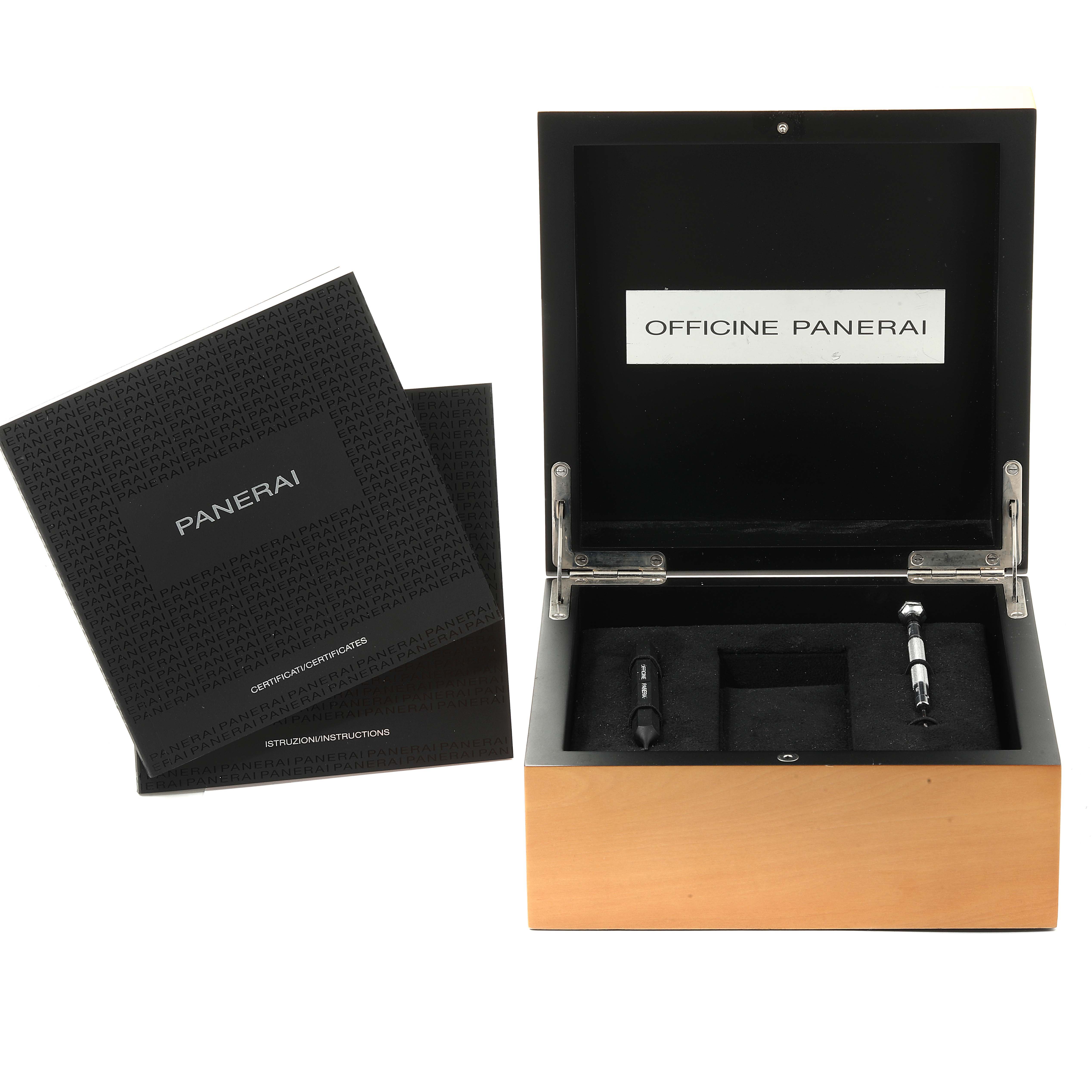 The image shows the open box and accessories for a Luminor model by Panerai.