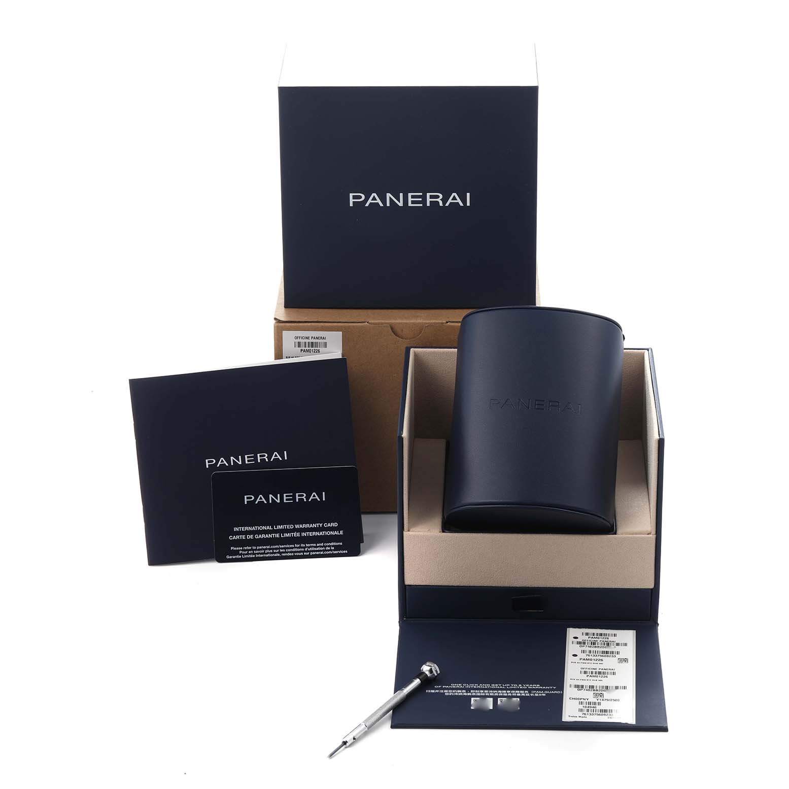 The image shows the packaging and accessories of a Panerai Submersible PAM01226 Men
s Stainless Steel White Dial PAM01226 Men
s Stainless Steel White Dial watch, including a box, case, warranty card, and tool.
