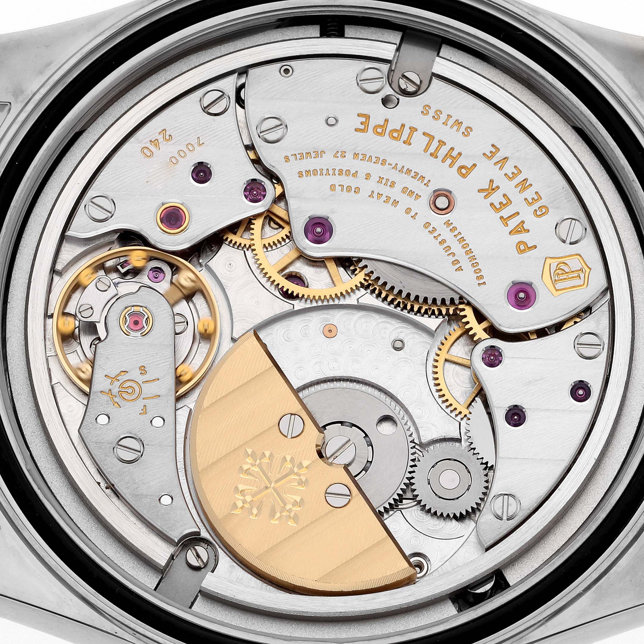 The image shows a close-up view of the movement and inner mechanical parts of a Patek Philippe Calatrava 6000G-012 Men's White Gold Blue Dial 6000G-012 Men's White Gold Blue Dial watch.