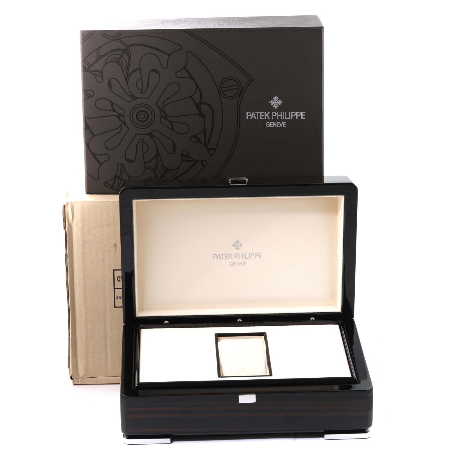 The image shows the packaging box and an open case of a Patek Philippe Complications 5327G-001 Men's White Gold Blue Dial 5327G-001 Men's White Gold Blue Dial watch set, including the main watch box.