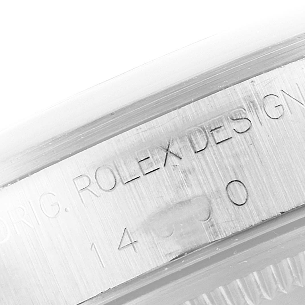 This image shows a close-up angle of the engraved case side of a Rolex Air-King 14000 Men's Stainless Steel Blue Dial 14000 Men's Stainless Steel Blue Dial watch.