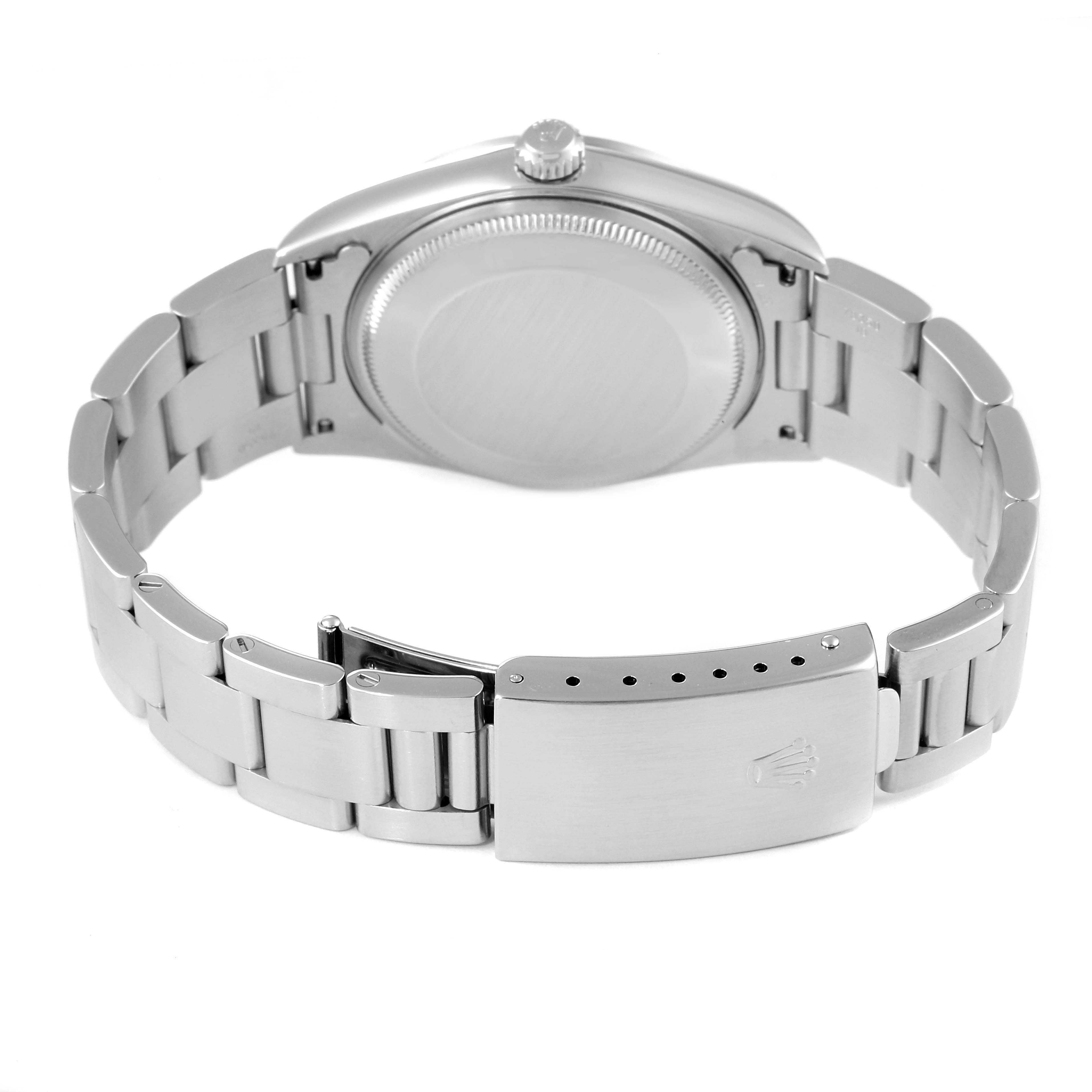 The image shows the back view of a Rolex Air-King 14000 Men's Stainless Steel Pink Dial 14000 Men's Stainless Steel Pink Dial watch, featuring its closed clasp and bracelet links.