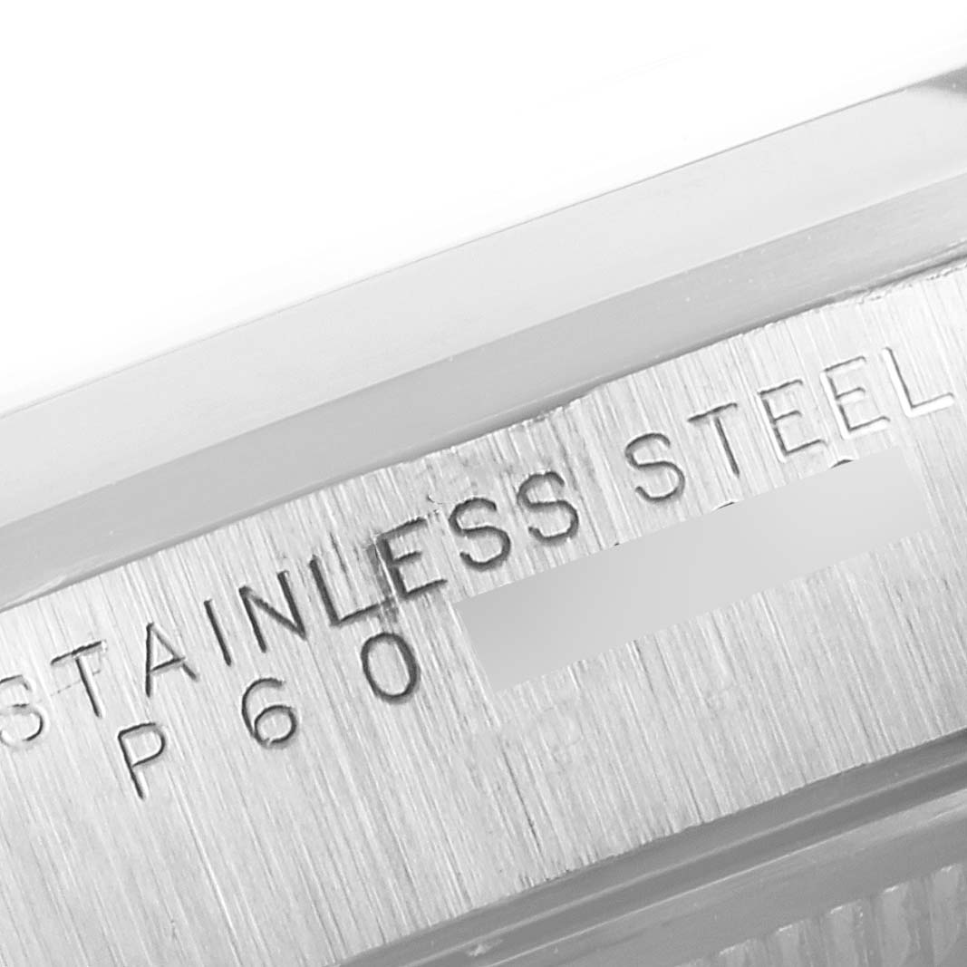 The image shows a close-up angle of the case back or edge of a Rolex Air-King 14000 Men's Stainless Steel Pink Dial 14000 Men's Stainless Steel Pink Dial watch, highlighting "Stainless Steel" engraving.