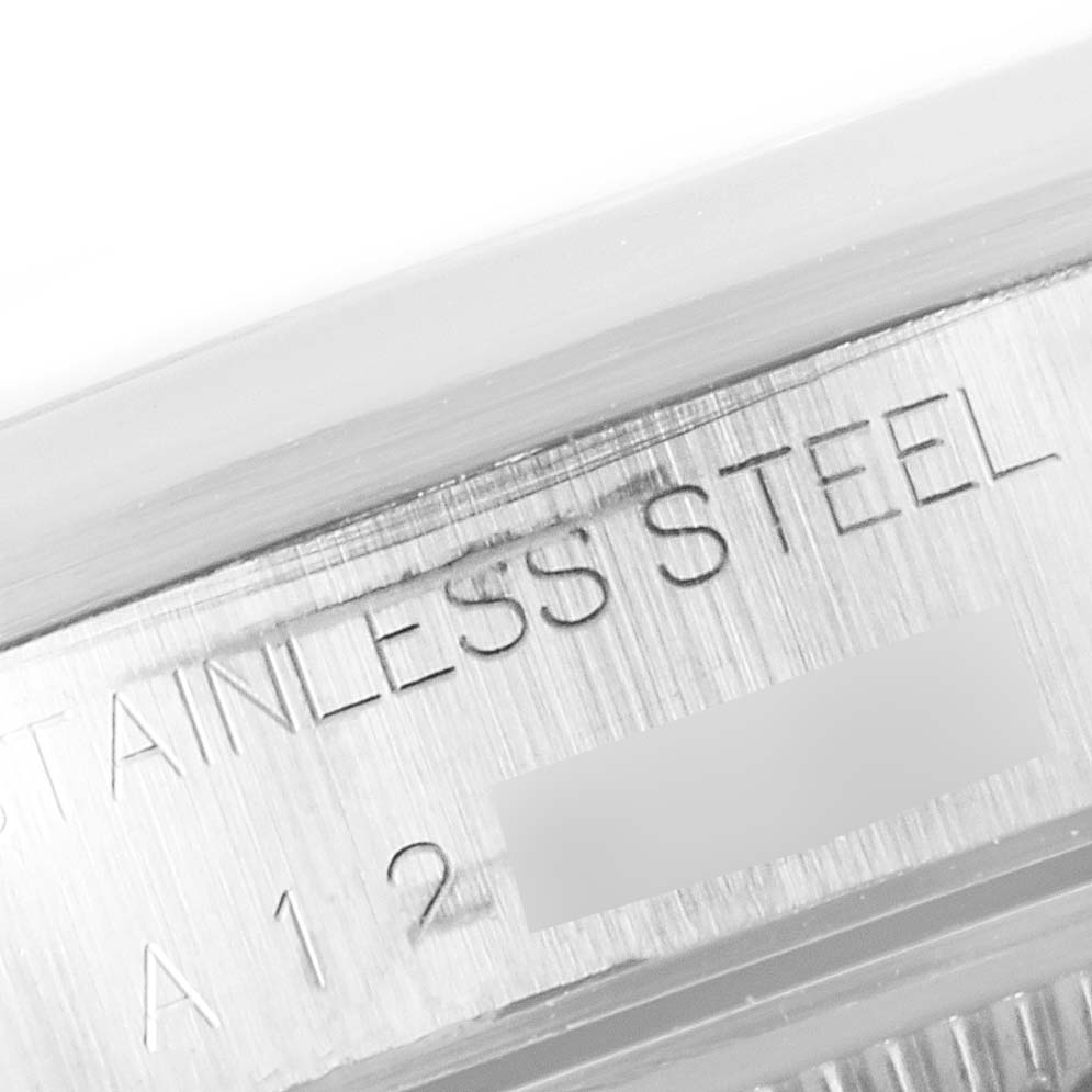 The image shows a close-up of the stainless steel casing of the Rolex Air-King 14000 Men's Stainless Steel Pink Dial 14000 Men's Stainless Steel Pink Dial watch, highlighting the engraved text.