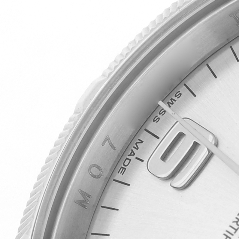 The image shows a close-up of the dial's edge and bezel of the Rolex Air-King 114210 Men's Stainless Steel Silver Dial watch.
