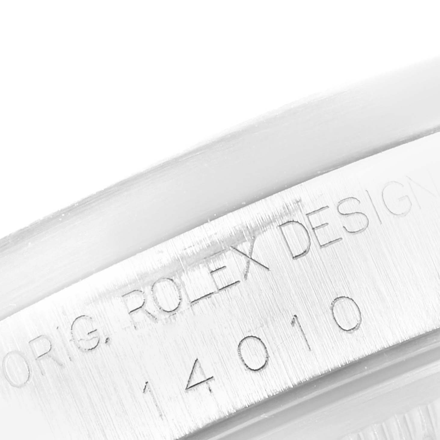 The image shows a close-up of the engraved bezel of a Rolex Air-King 14010 Men's Stainless Steel Silver Dial 14010 Men's Stainless Steel Silver Dial watch.