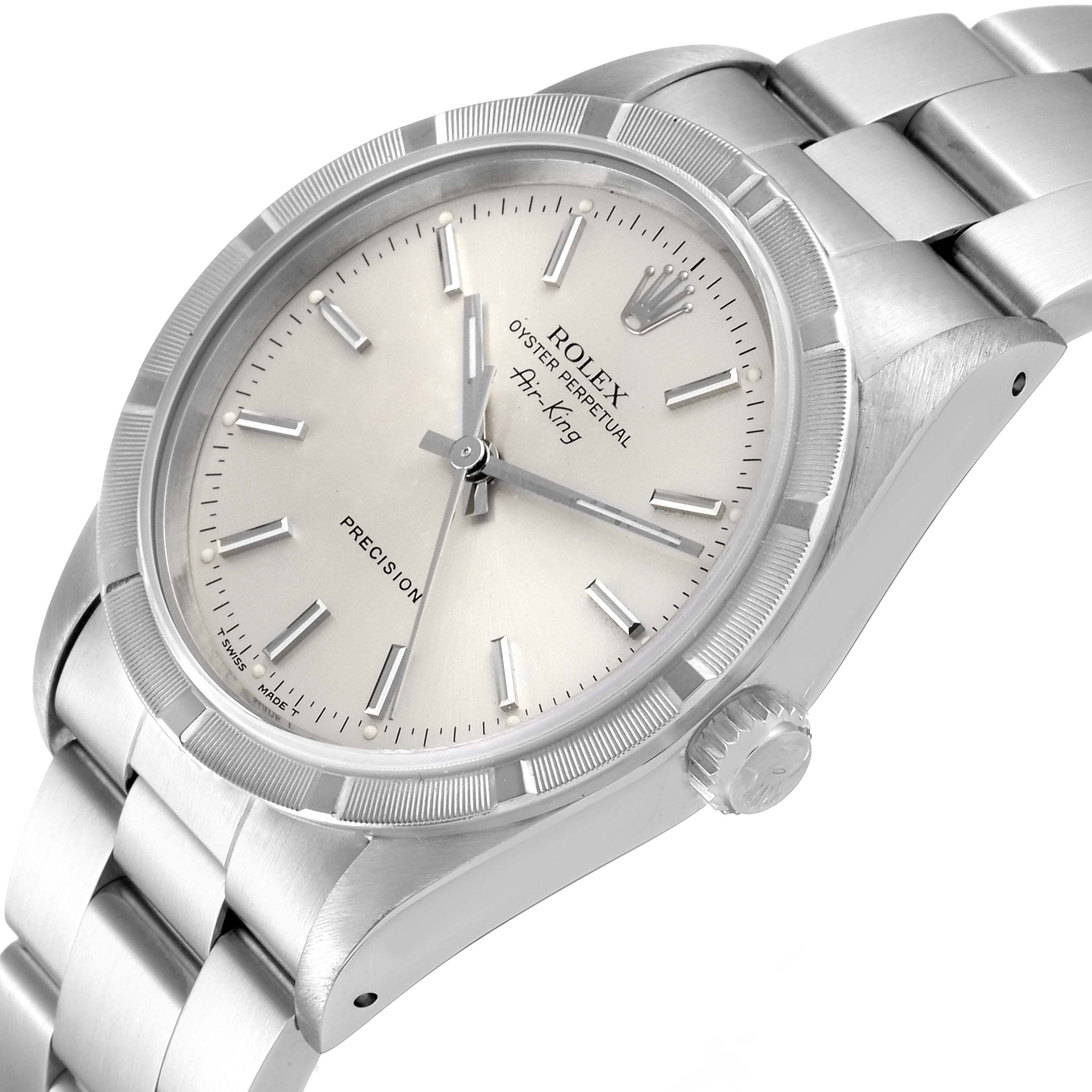 The Rolex Air-King 14010 Men's Stainless Steel Silver Dial 14010 Men's Stainless Steel Silver Dial watch is shown at an angle displaying its dial, bezel, case, crown, and bracelet.