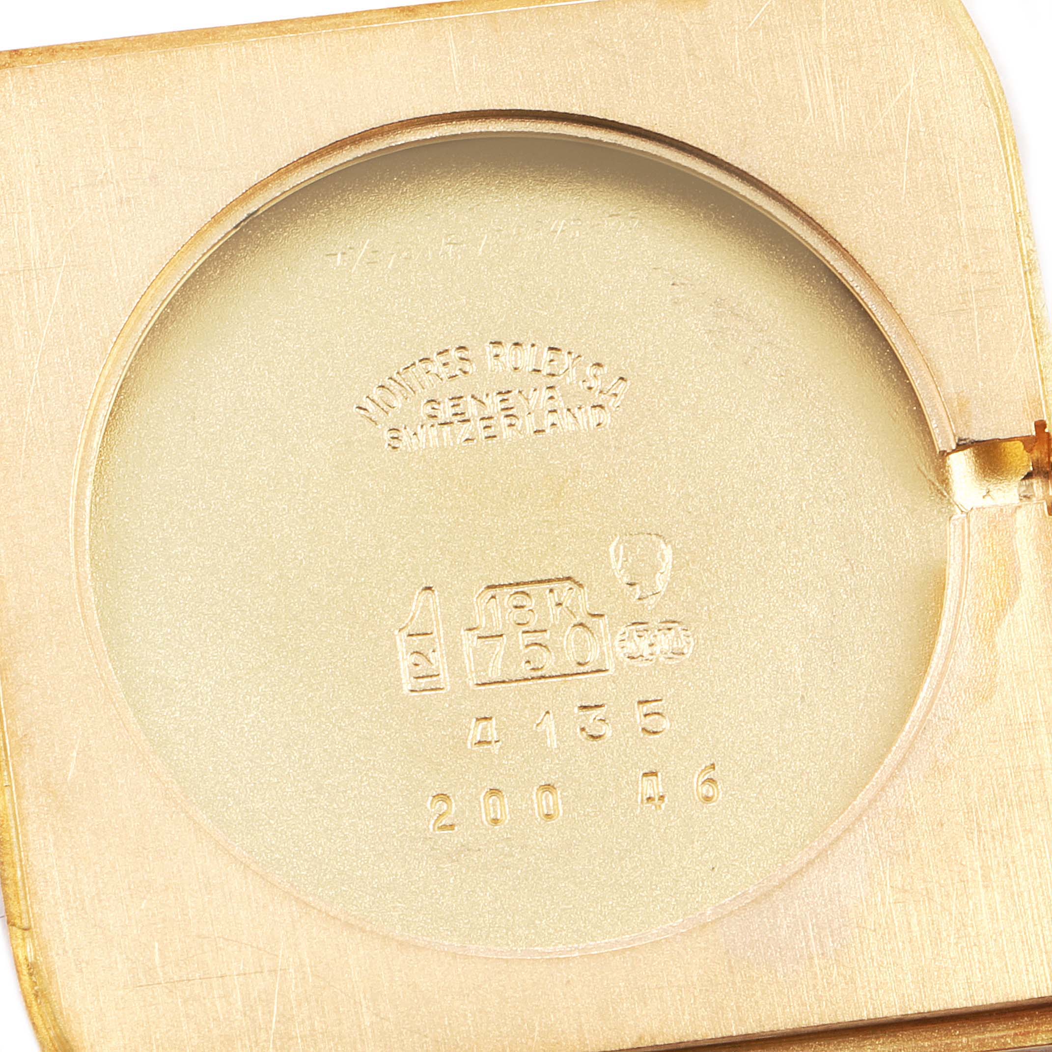 This image shows the interior case back of a Rolex Cellini 4135 Men's Yellow Gold Champagne Dial 4135 Men's Yellow Gold Champagne Dial watch, stamped with model and material details.