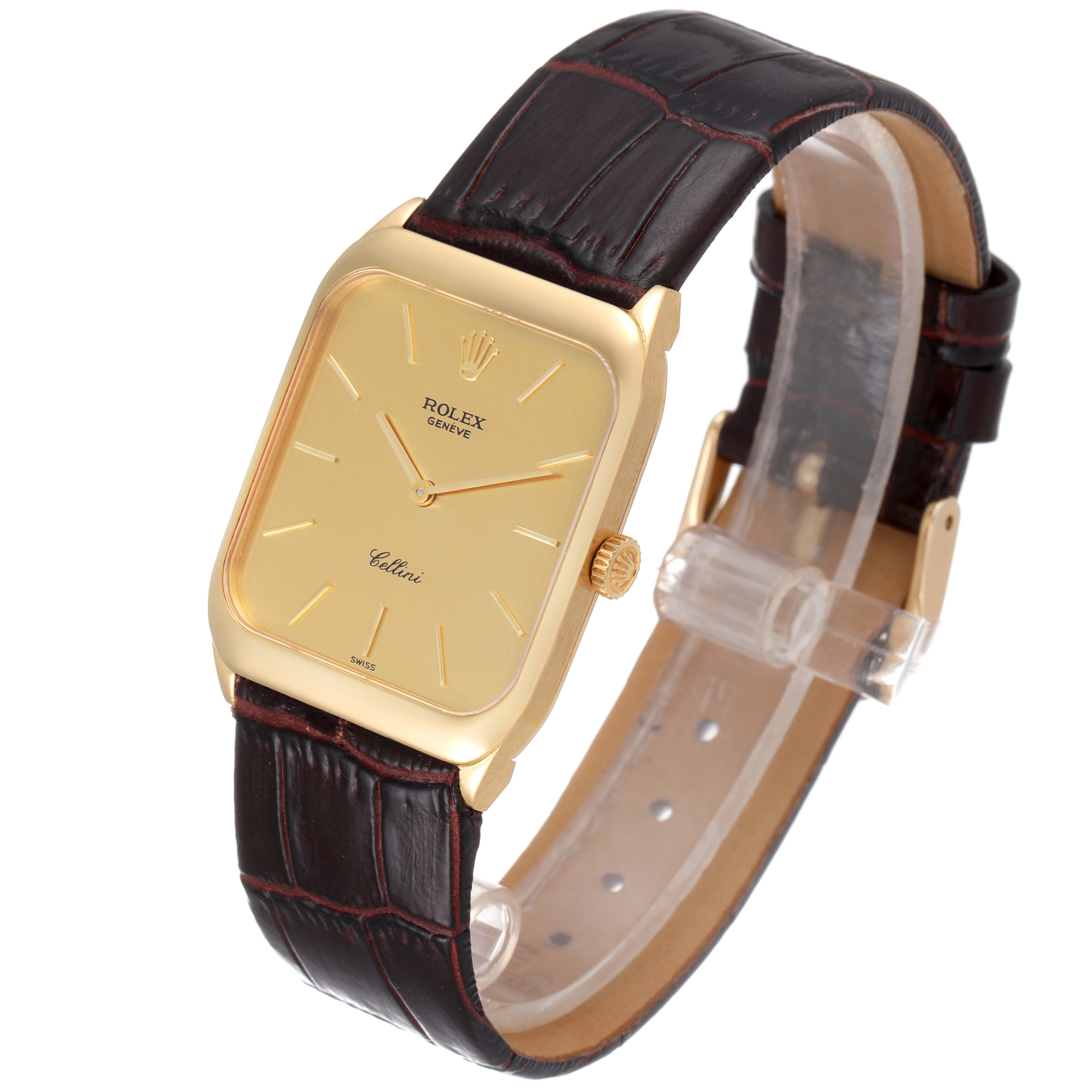 The image shows an angled view of the Rolex Cellini 4135 Men's Yellow Gold Champagne Dial 4135 Men's Yellow Gold Champagne Dial watch, highlighting its gold case, dial, and leather strap.