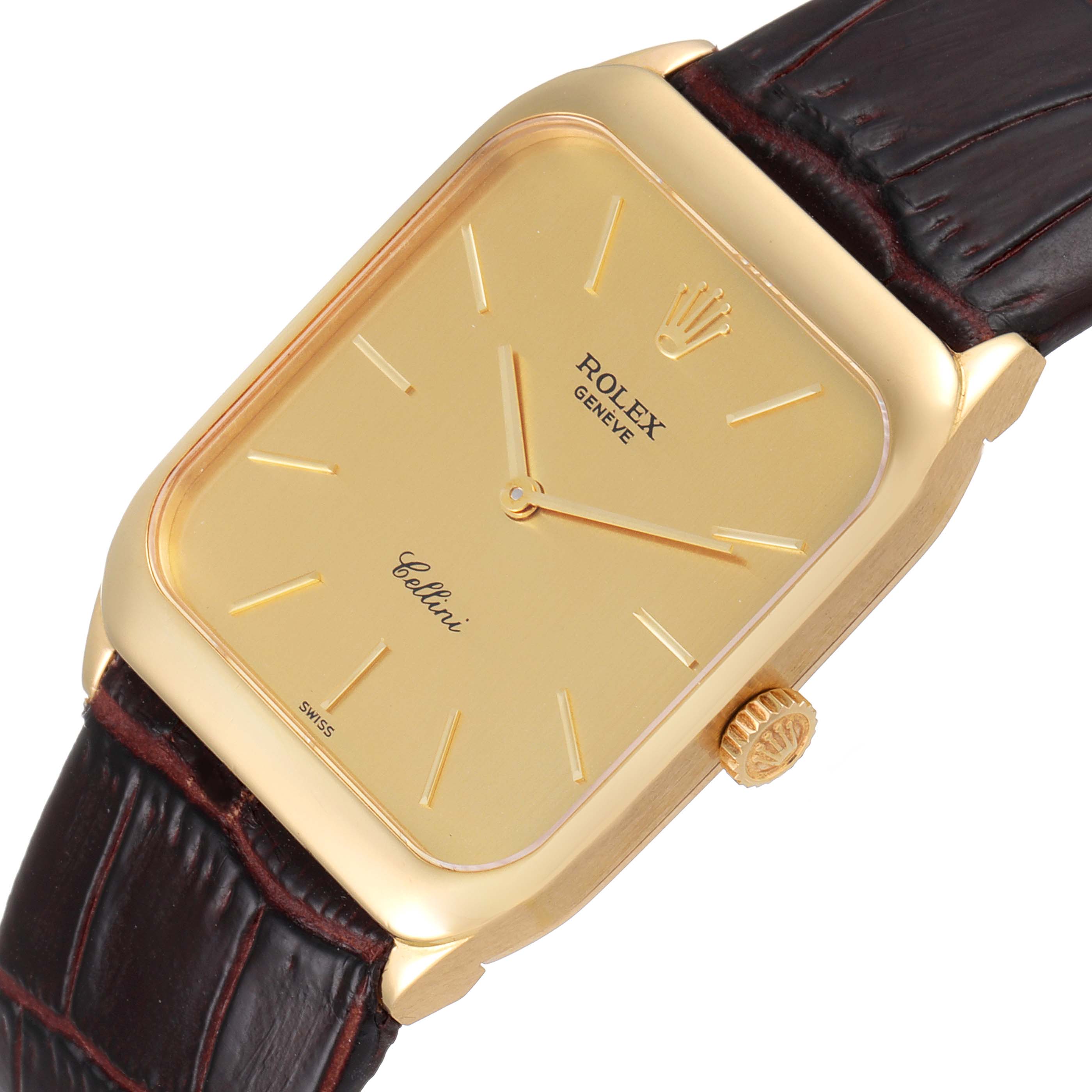 This image shows a close-up view of the dial and crown of a Rolex Cellini 4135 Men's Yellow Gold Champagne Dial 4135 Men's Yellow Gold Champagne Dial watch with a gold finish and a leather strap.