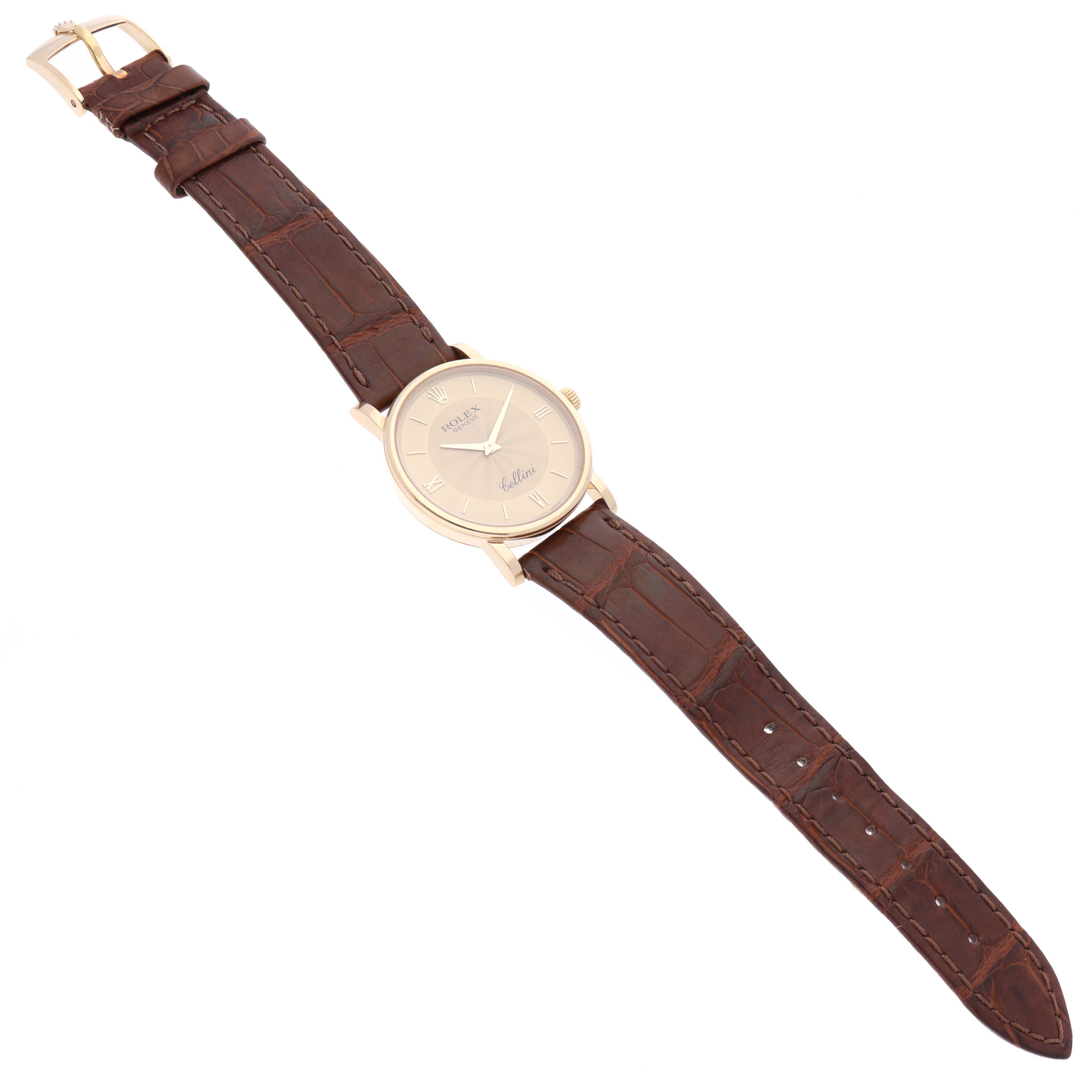 This image shows a top view of a Rolex Cellini 5115 Men's Yellow Gold Champagne Dial 5115 Men's Yellow Gold Champagne Dial watch, featuring a brown leather strap and a round gold-tone case.