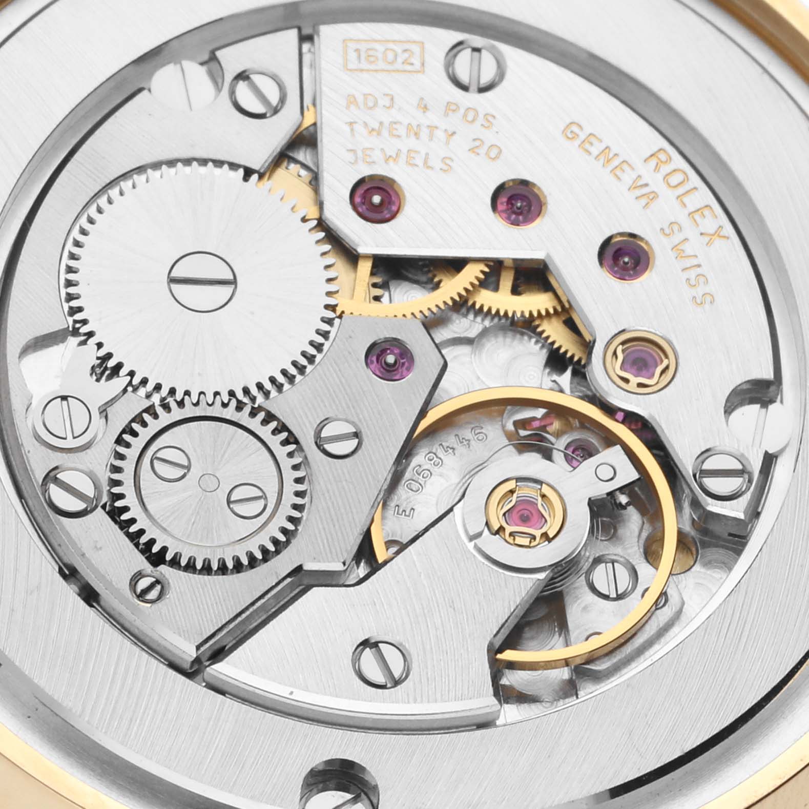 This image shows a close-up of the movement mechanism inside a Rolex Cellini 5115 Men's Yellow Gold Champagne Dial 5115 Men's Yellow Gold Champagne Dial watch, highlighting gears and jewels.