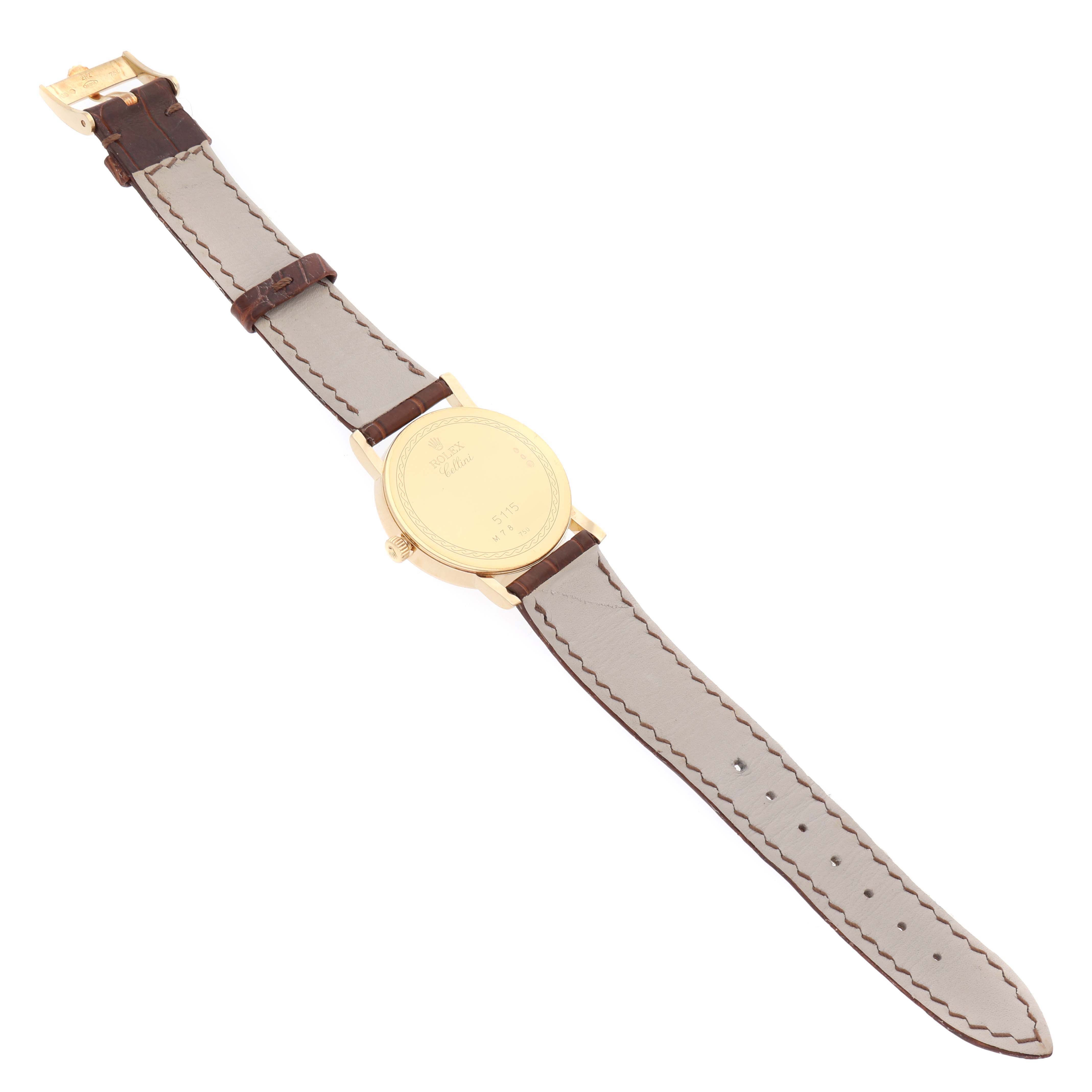 The image shows the back view of a Rolex Cellini 5115 Men's Yellow Gold Champagne Dial 5115 Men's Yellow Gold Champagne Dial watch, displaying the case back and the full leather strap.