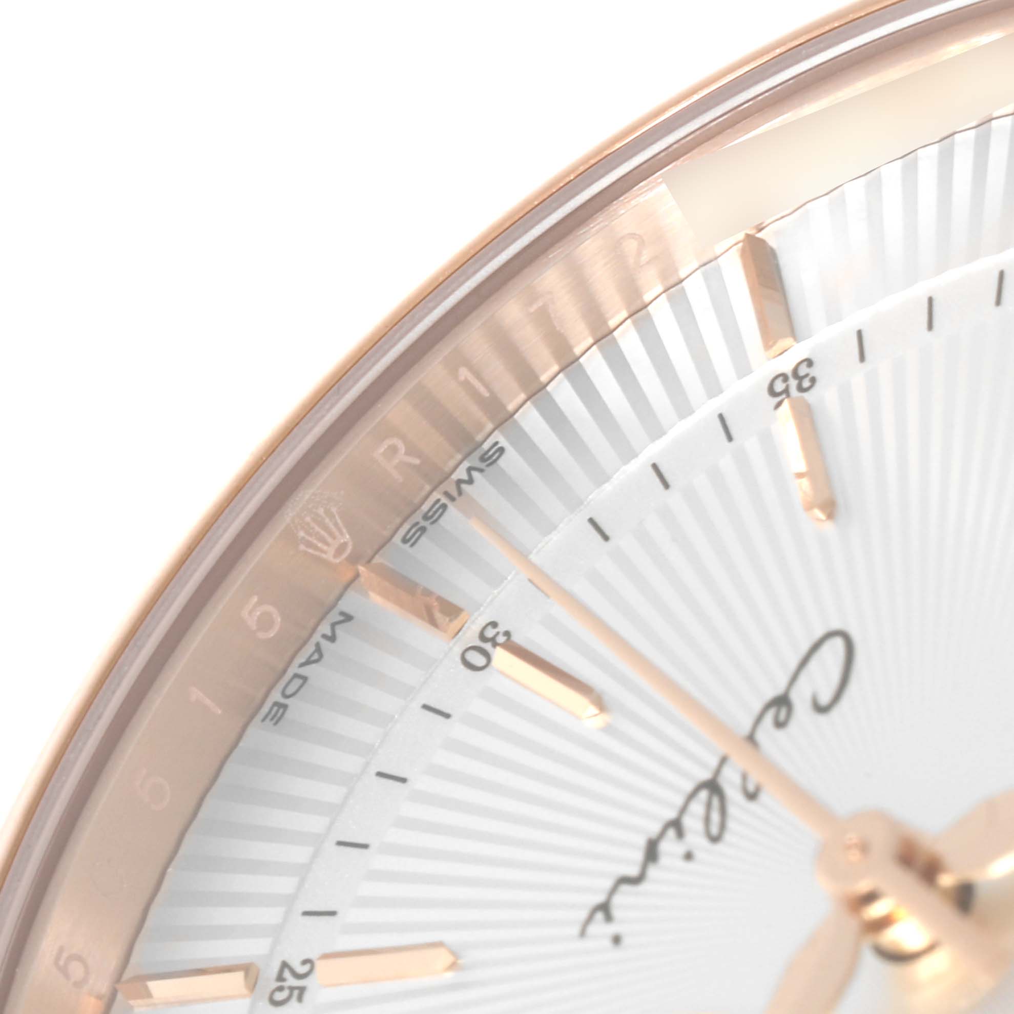 This image shows a close-up of the dial, hands, and part of the bezel of a Rolex Cellini 50515 Men's Rose Gold Silver Dial 50515 Men's Rose Gold Silver Dial watch at an angle.