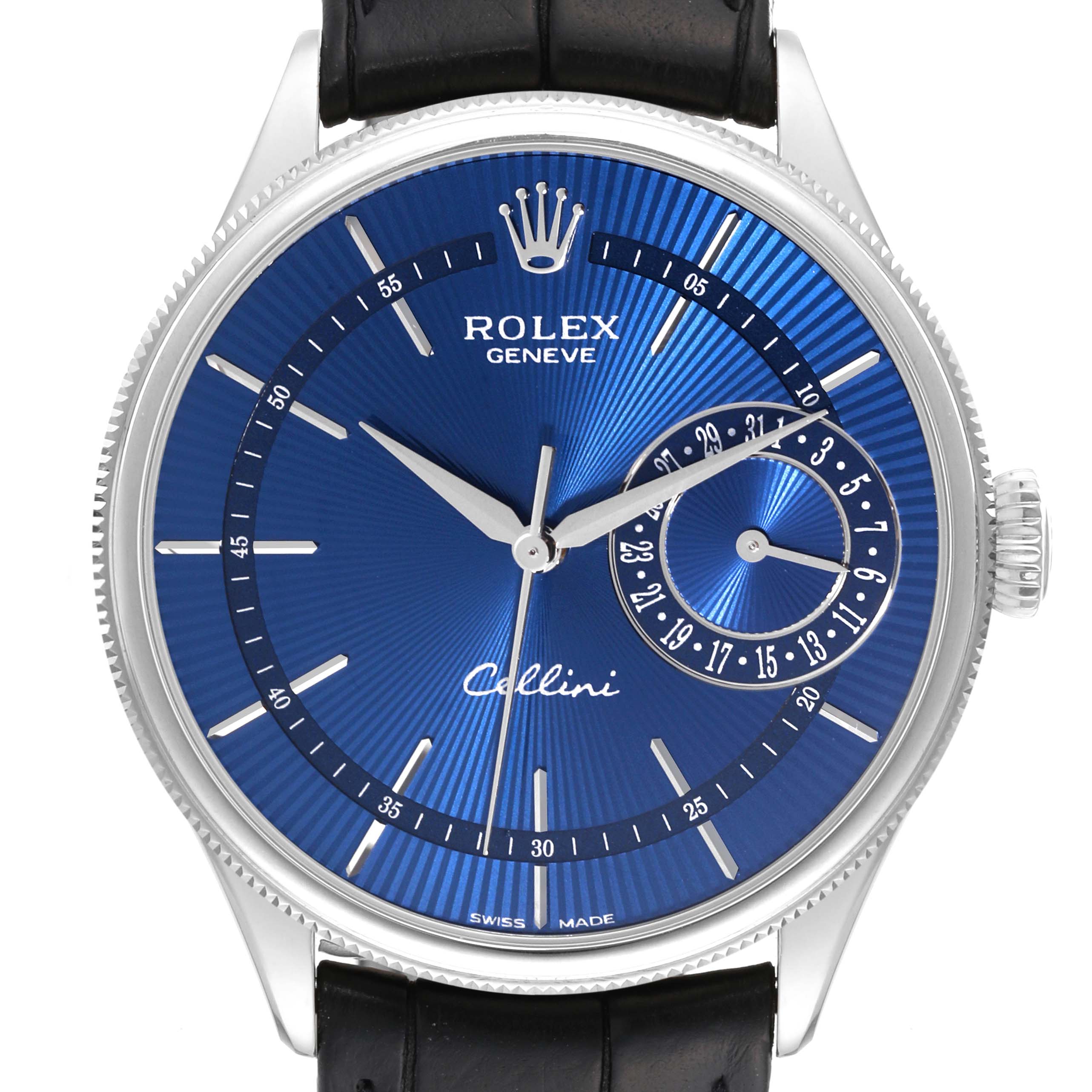 The image shows a front view of the Cellini model by Rolex, highlighting its blue dial, hour markers, hands, and date subdial.