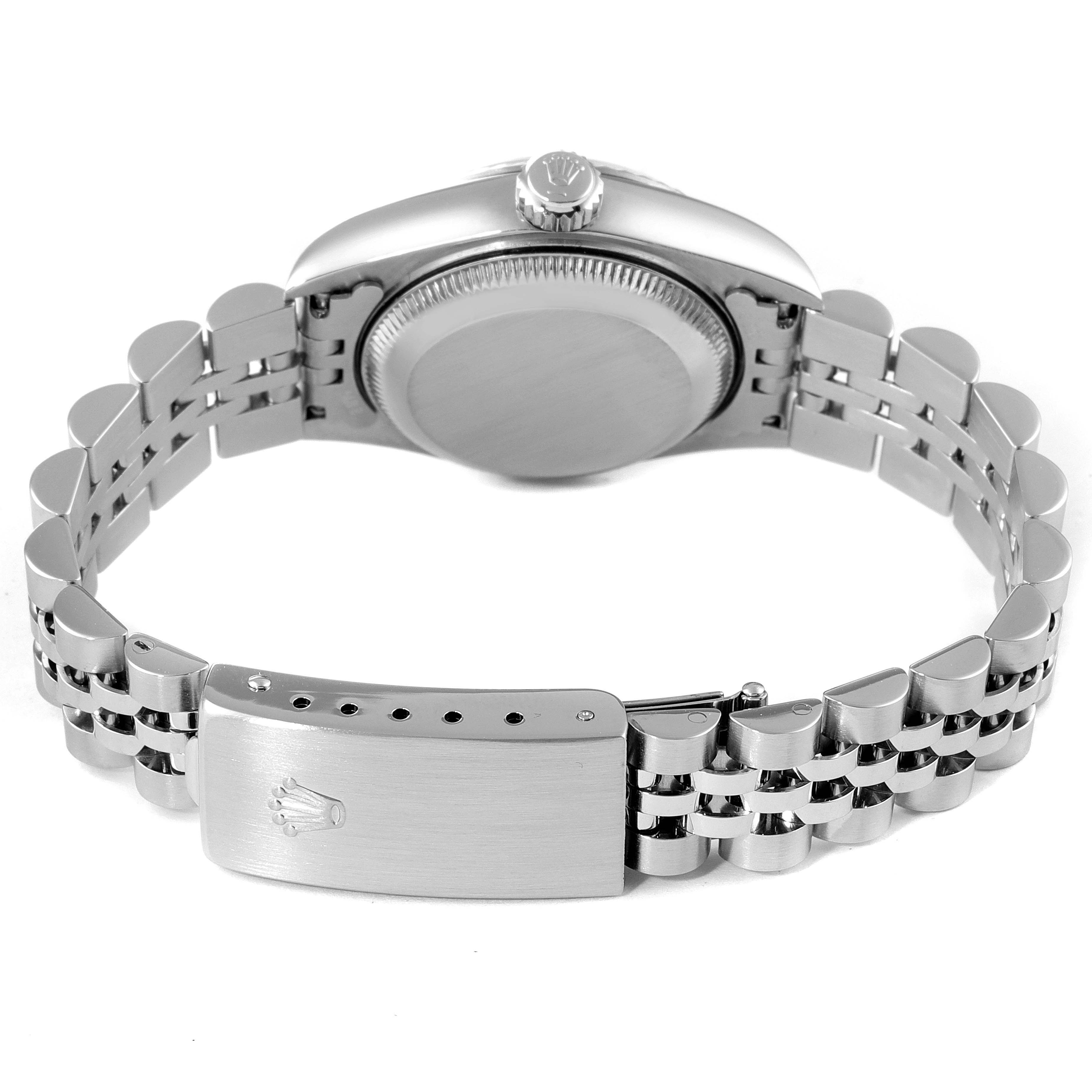 The image shows the back view of a Rolex Datejust 79174 Women
s Stainless Steel Silver Dial 79174 Women
s Stainless Steel Silver Dial watch, highlighting its case, screw-down crown, and jubilee bracelet with clasp.