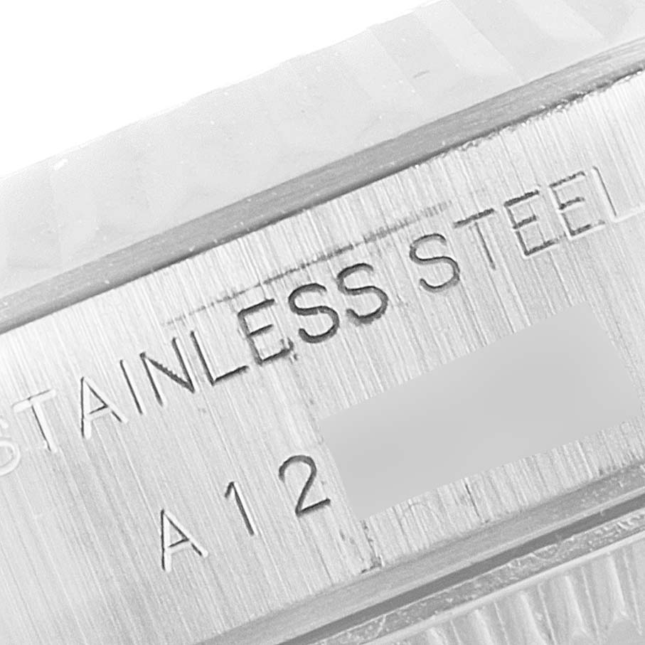 This close-up image shows the engraved "Stainless Steel" text on the side of the Rolex Datejust 79174 Women
s Stainless Steel Silver Dial 79174 Women
s Stainless Steel Silver Dial watch.