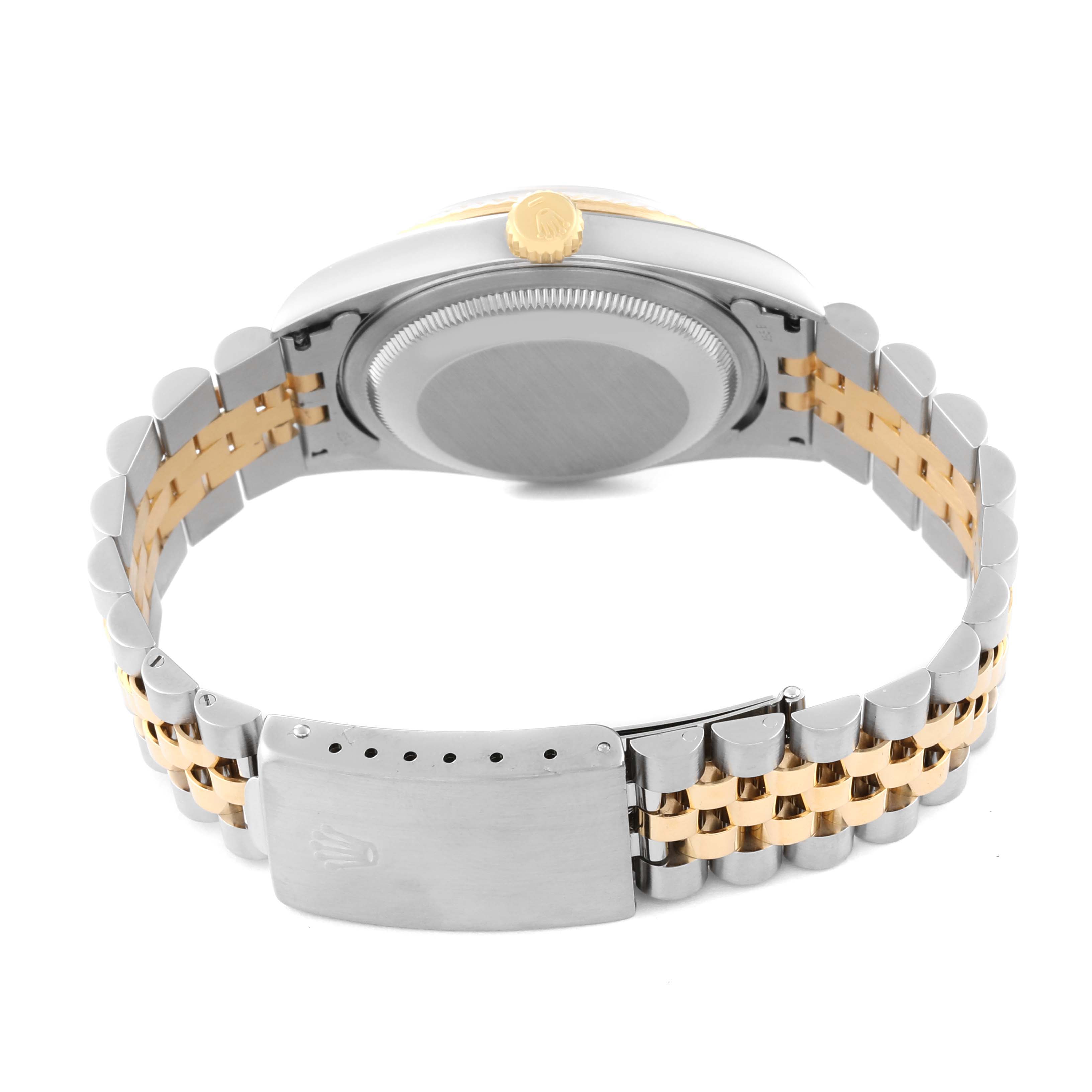 The image shows the back view of the Rolex Datejust 16233 Men's Steel and Gold (two tone) Champagne Dial 16233 Men's Steel and Gold (two tone) Champagne Dial watch, highlighting its metal bracelet and clasp.